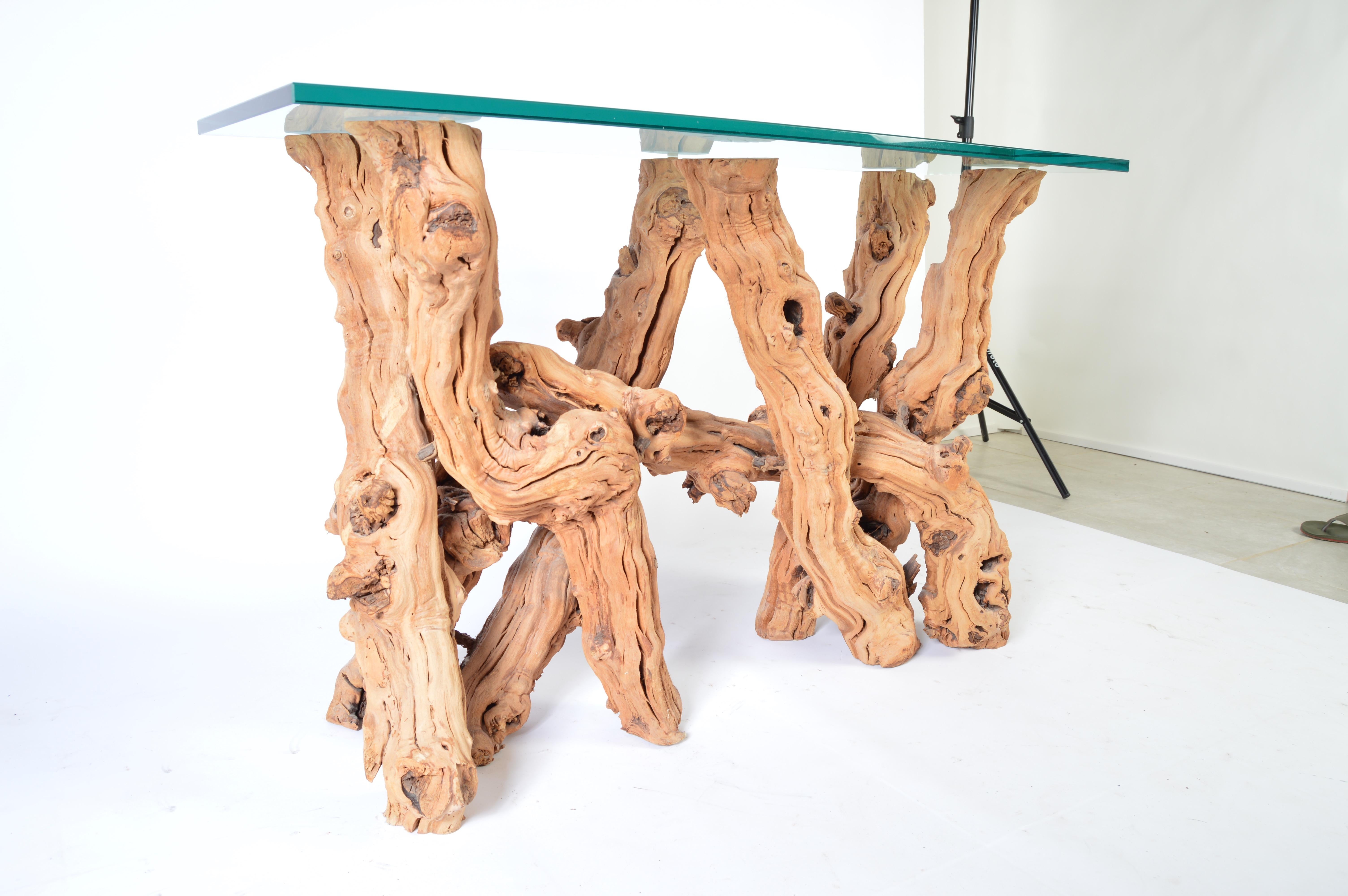 A stunning free-form Cypress root console table having a 3/4