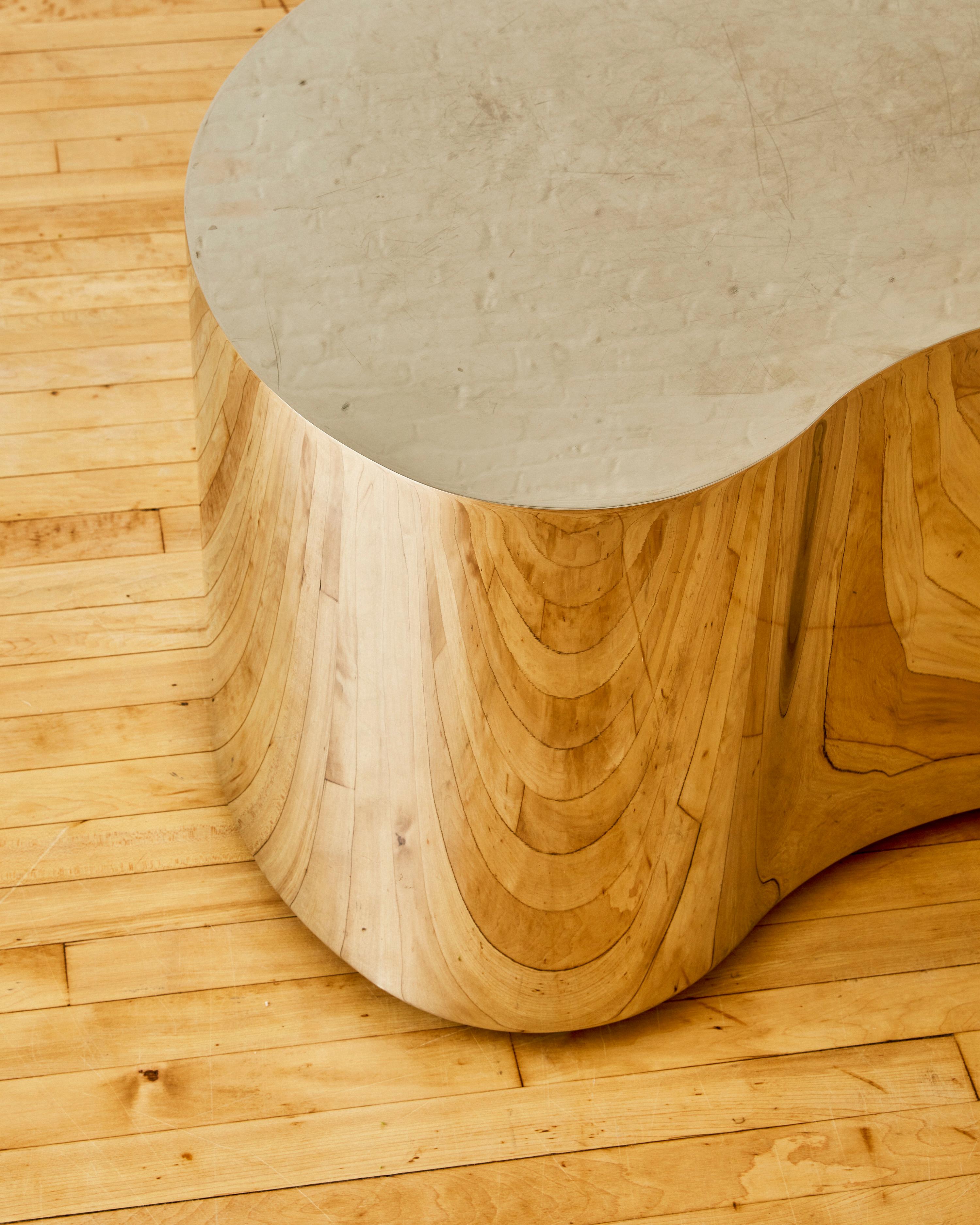 Free Form Side Table by Karl Springer with in mirror polished stainless steel on adjustable feet. Unsigned 

Karl Springer (1931–1991) was a German-born American furniture designer renowned for his luxurious and innovative designs. He began his