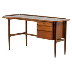 Free-form teak desk. 1950s.
