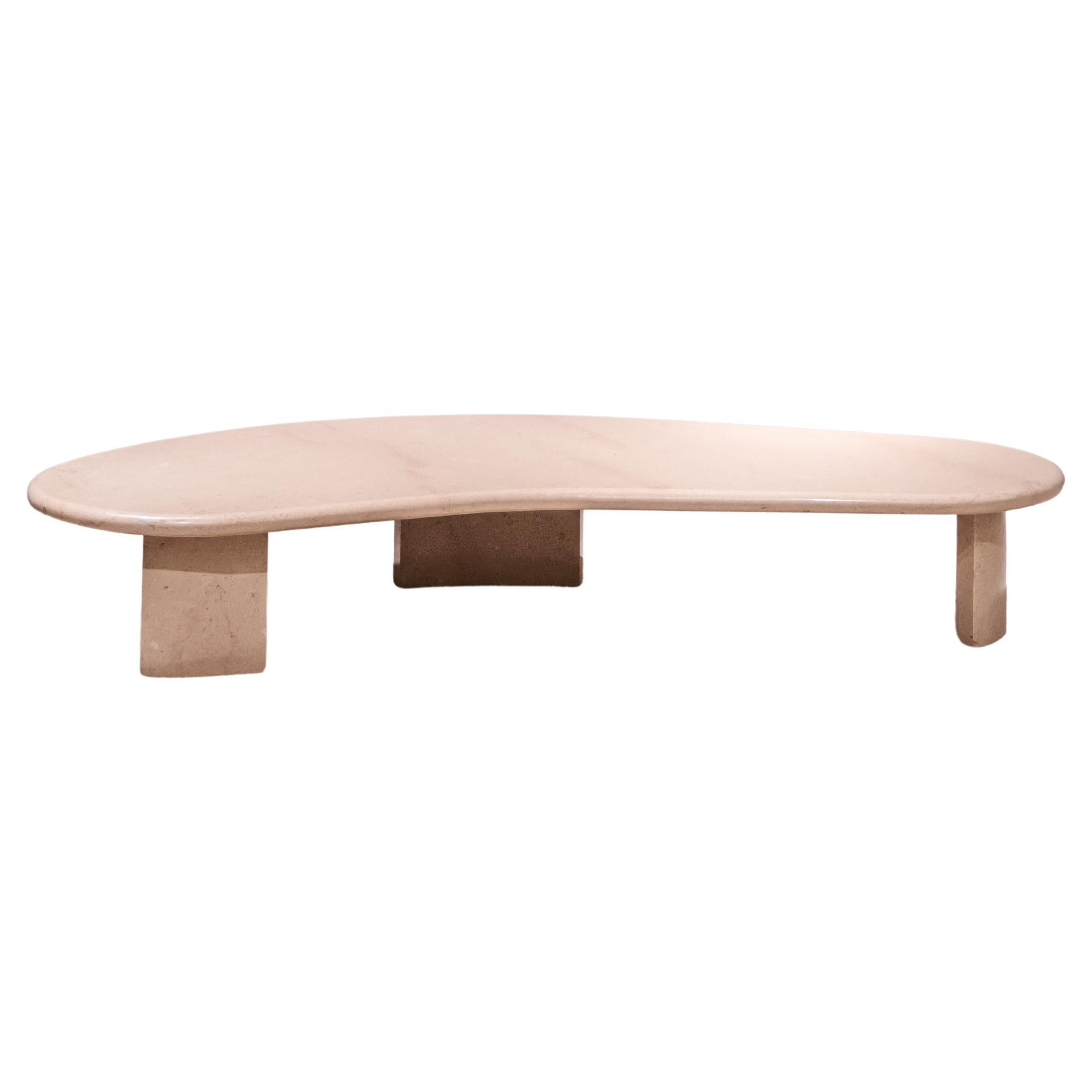 Free-form travertine coffee table