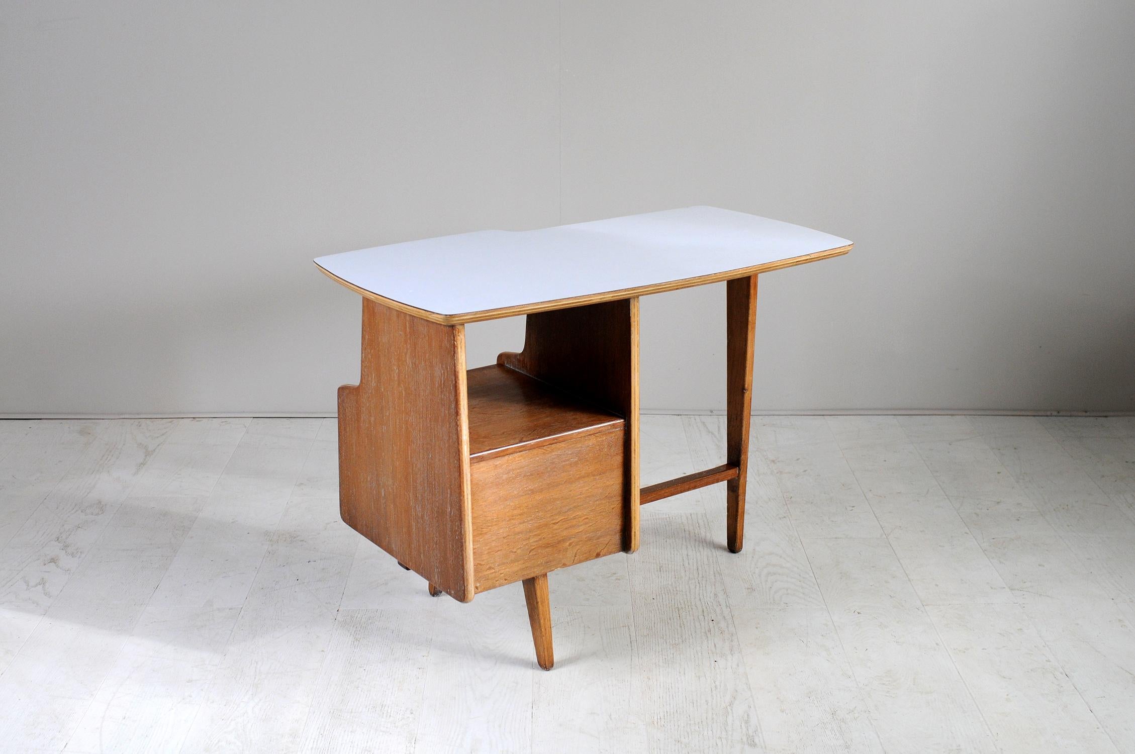 Rare cerused oak and light gray formica child's desk from Jacques Hauville, Bema edition, France, 1950.
Freeform tray, two-drawer pedestal and tripod base.
 