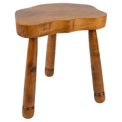 Free form tripod stool in elm wood, made in French Brittany in the 1950s