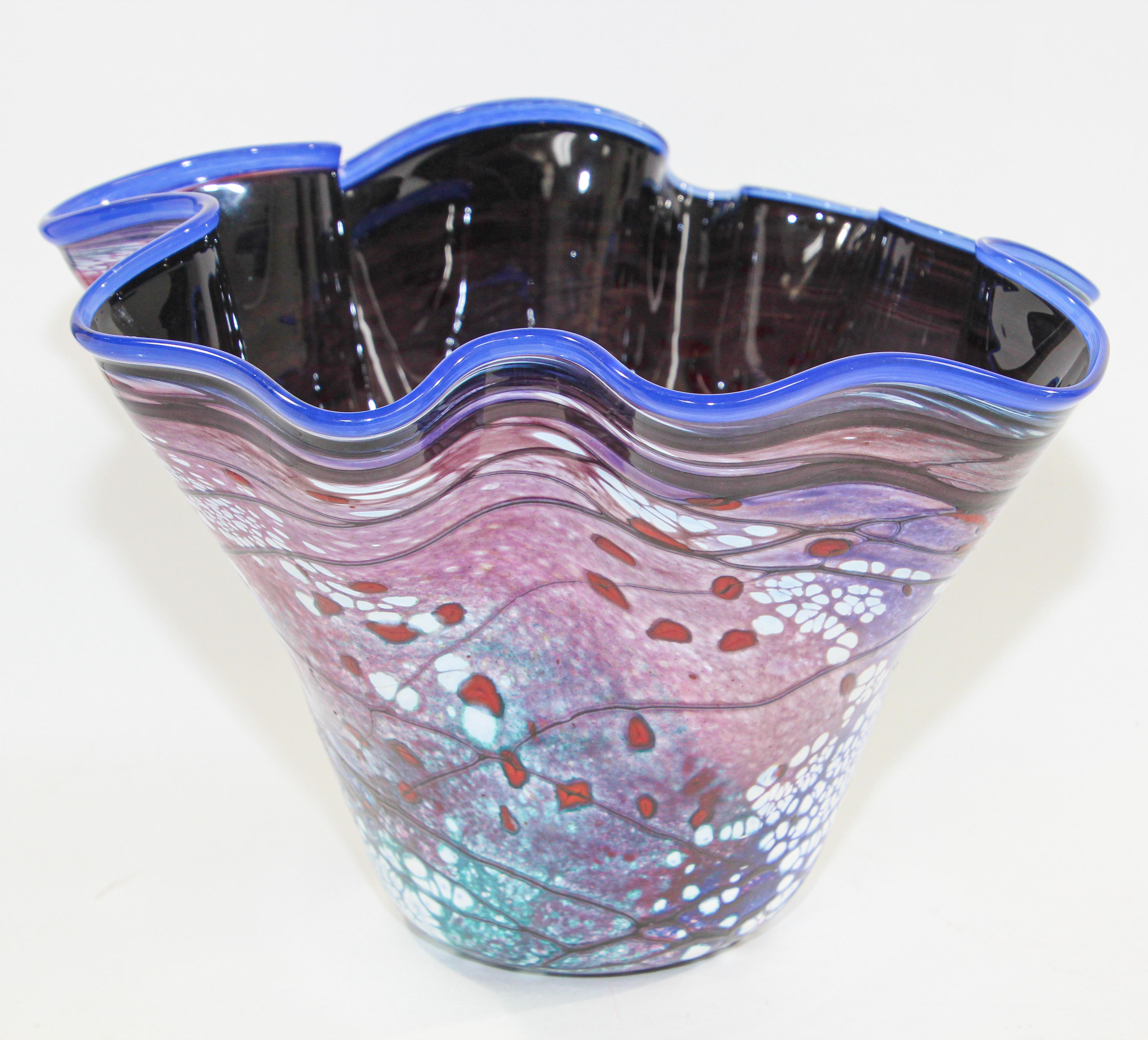 Free form organic modern contemporary blown art glass vase.
Dark blue Inside with multicolored designs outside. 
Signed by Artist Bill Kasper. 
Overall Condition Good
Size 10
