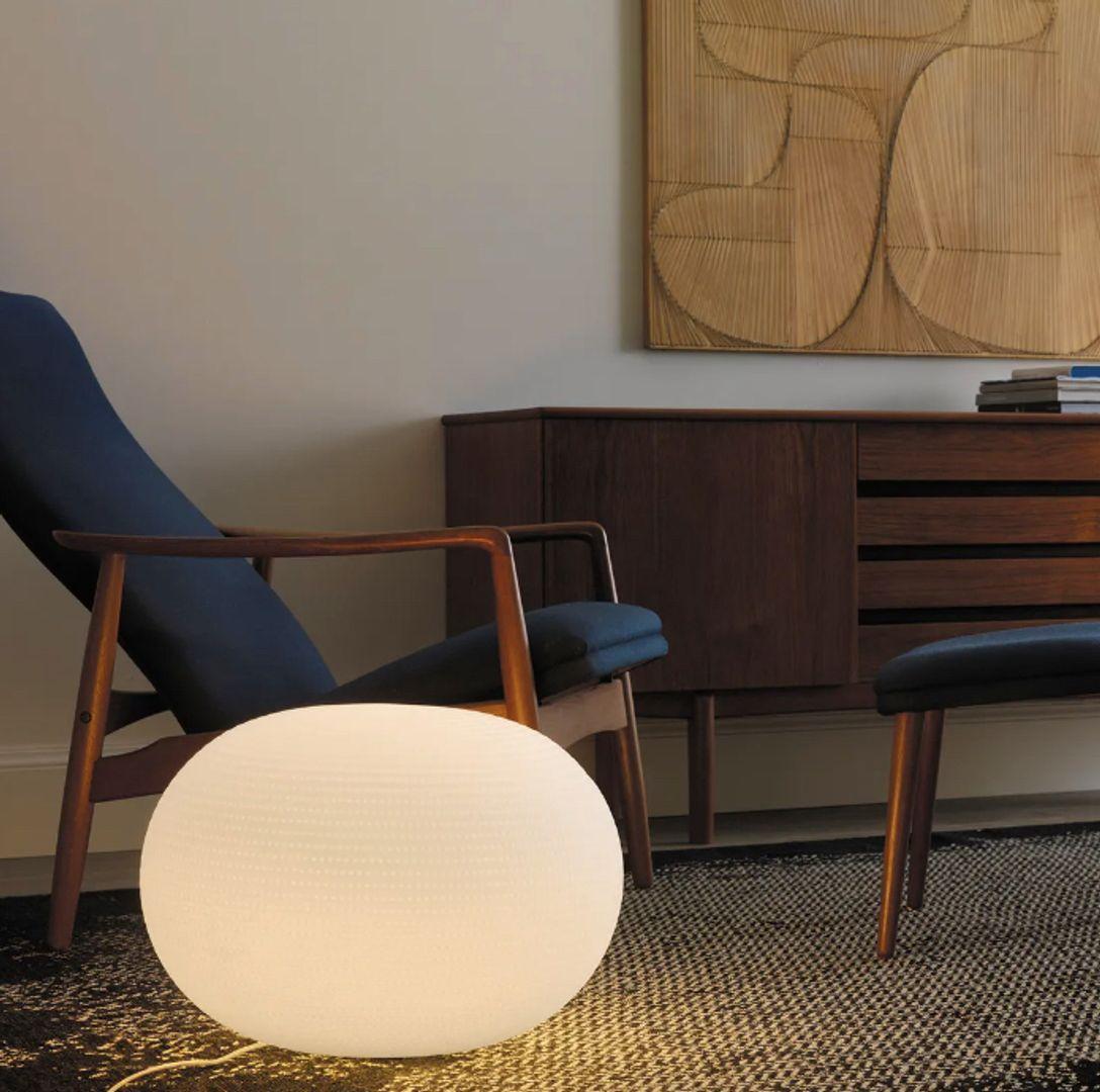 Bianca is a family of luminaires with the decoration on the diffuser surface features an orderly series of shallow delicate grooves etched into the white glass, yielding an effect resembling small footprints on fresh snow. Mouth blown, belt sanded
