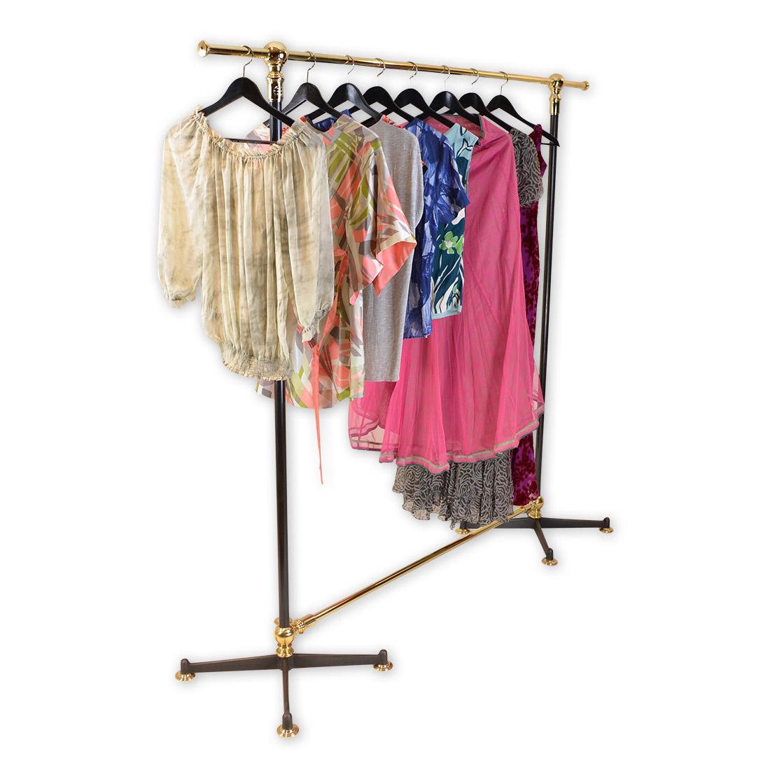The Brighton, an Andrew Nebbett designs large clothes rail in brass, steel and cast iron base. This Brighton clothes rail is tailor-made to order and is handmade, coloured, patinated and finished in our English workshops from the finest quality