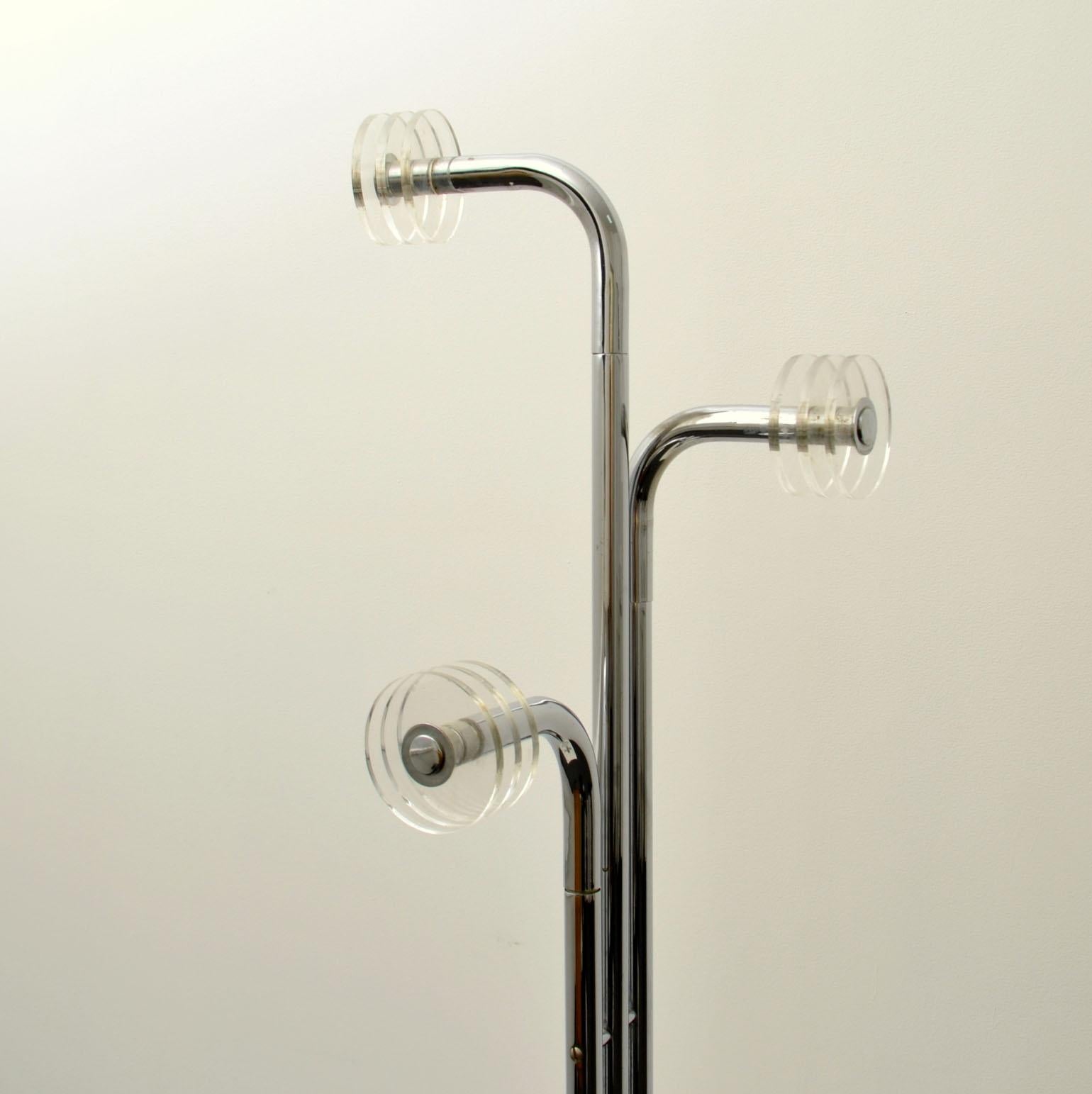 Sculptural Italian 1960s freestanding coat stand has three chrome arms with Perspex hooks and two rings for scarfs stands. The base is carrara marble black with white and gold veins.