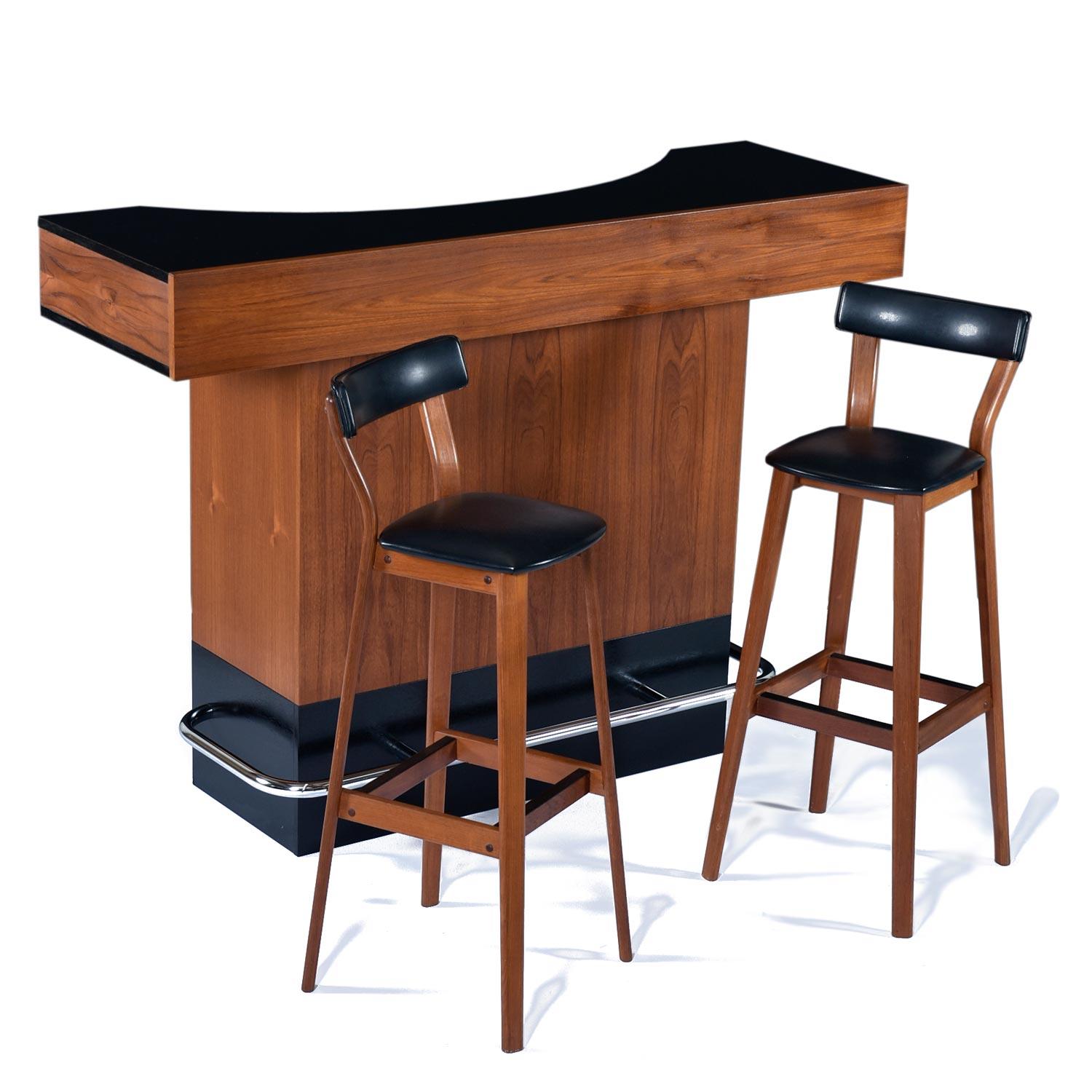 Exceptional free standing Danish teak bar complete with a pair of Tarm Stole bar stools. The outstanding dry bar resembles, but exceeds, Erik Buch’s popular design. This vintage 1960s bar features an ample counter top surface. The easy to maintain