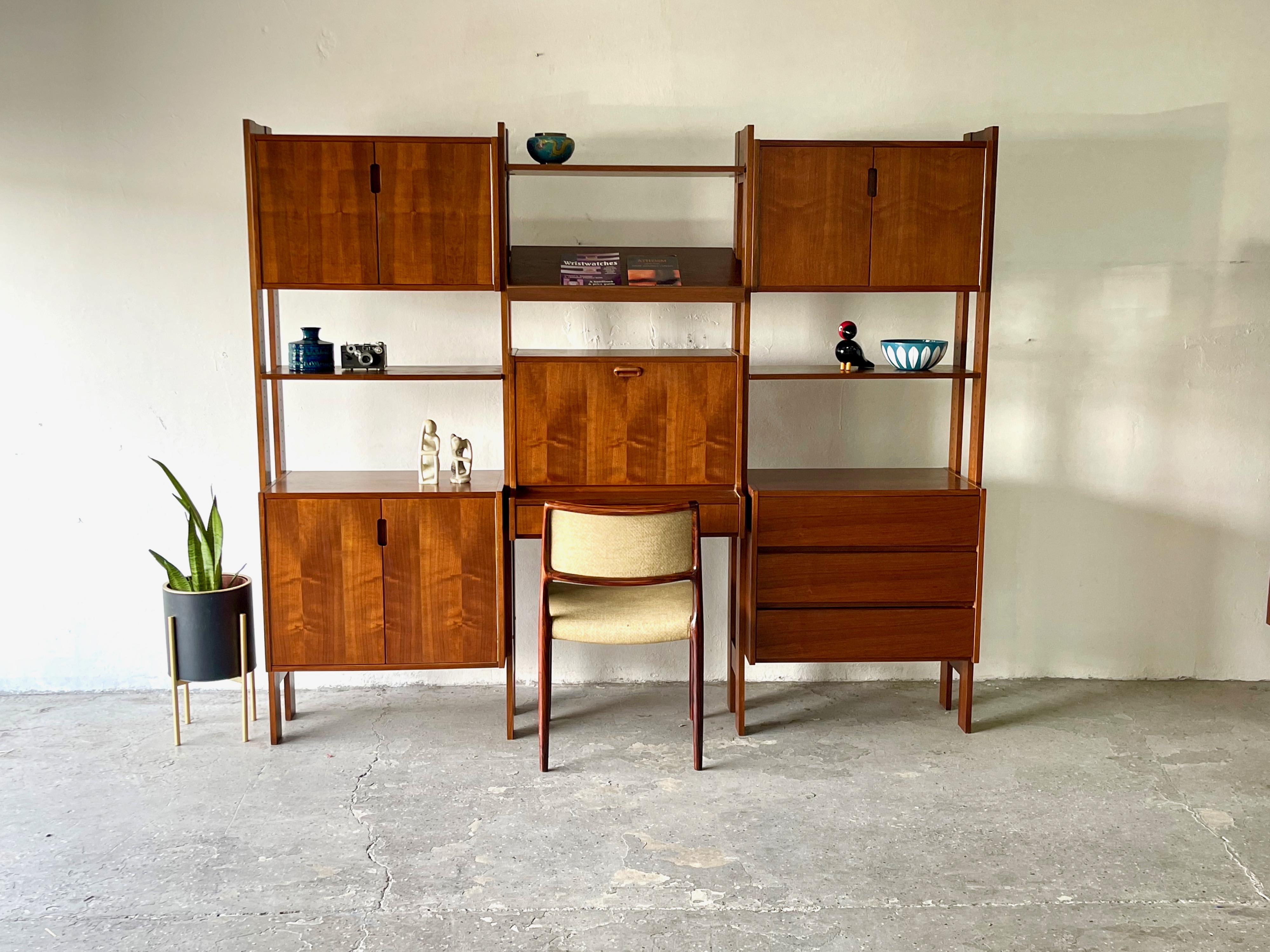 Vintage Modern 3 bay wall / divider unit Modular unit shelving system. Free-standing and finished on backside, allowing for room divider capability. This unit is perfect for maximizing smaller spaces, offering a multitude of storage solutions and