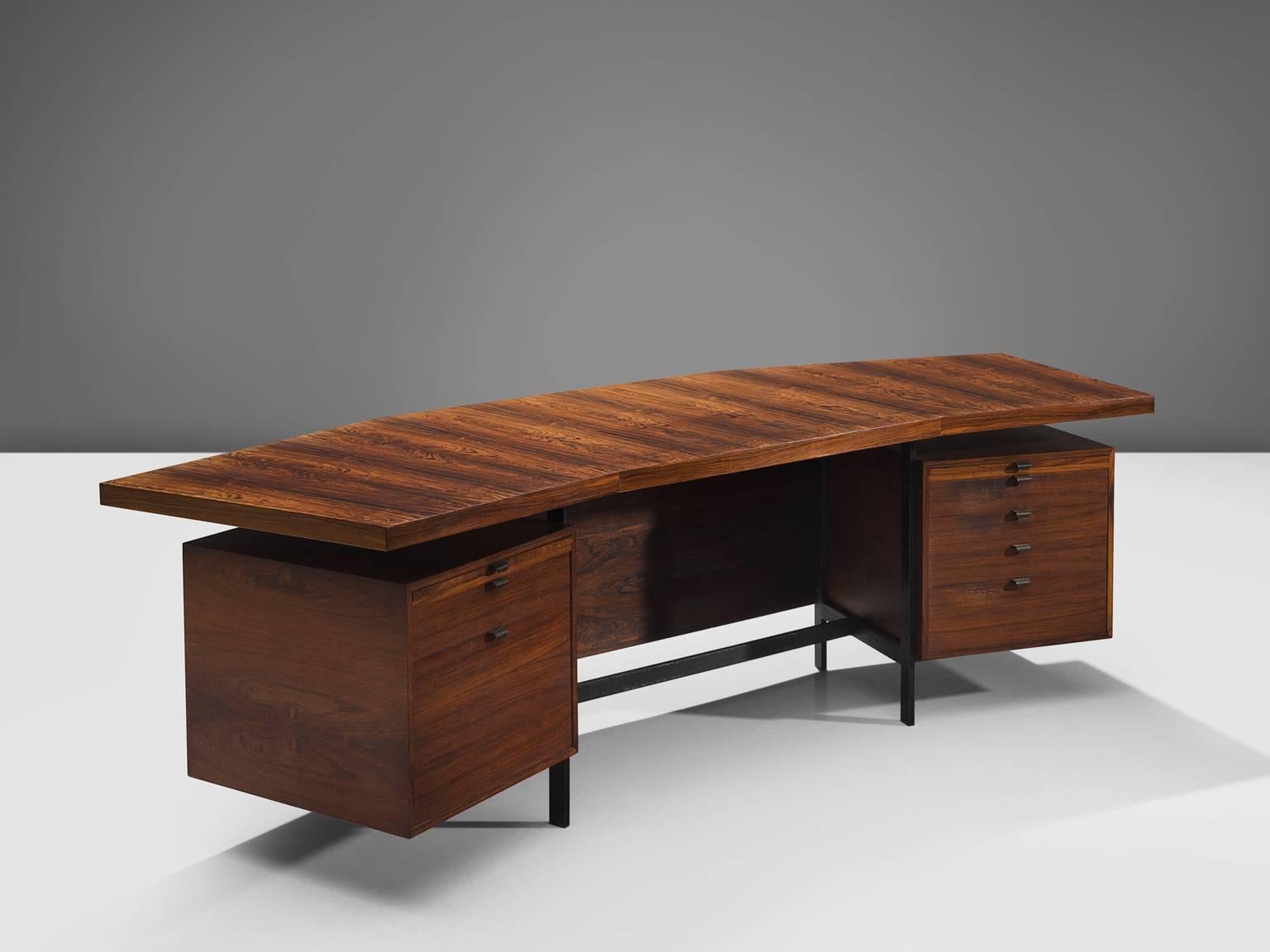 Executive desk, rosewood, metal, Italy, circa 1950.

This executive desk is attributed to Osvaldo Borsani. It has the characteristic features such as the angled top and the black leather back. The frame is executed in black metal and the detailing