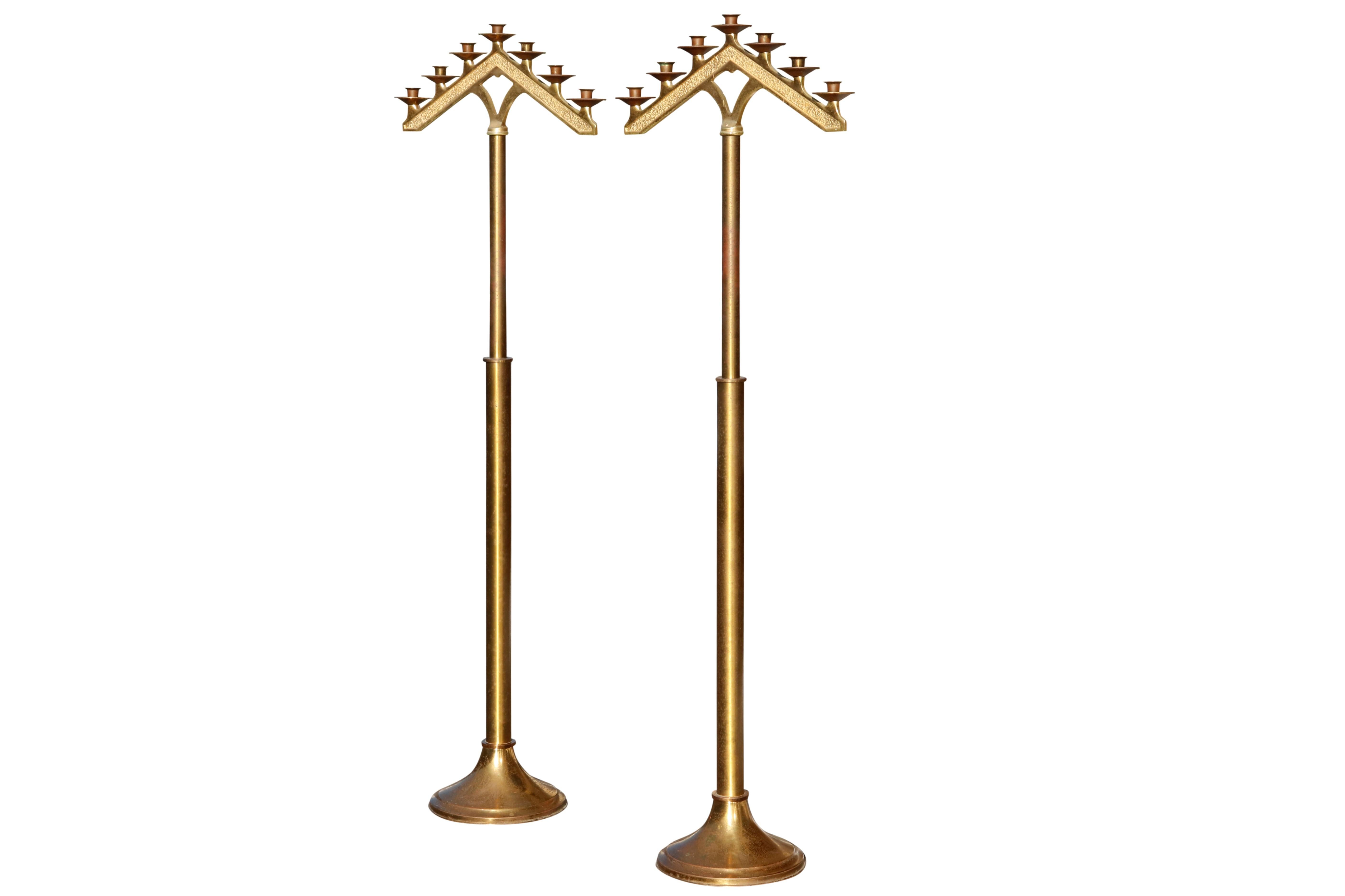 A pair of free standing, gold metal seven branch temple floor menorah. An old symbol of Judaism, the seven branch menorah is seen in artwork, carvings and synagogue decorations the world over. Dimensions per menorah.

 