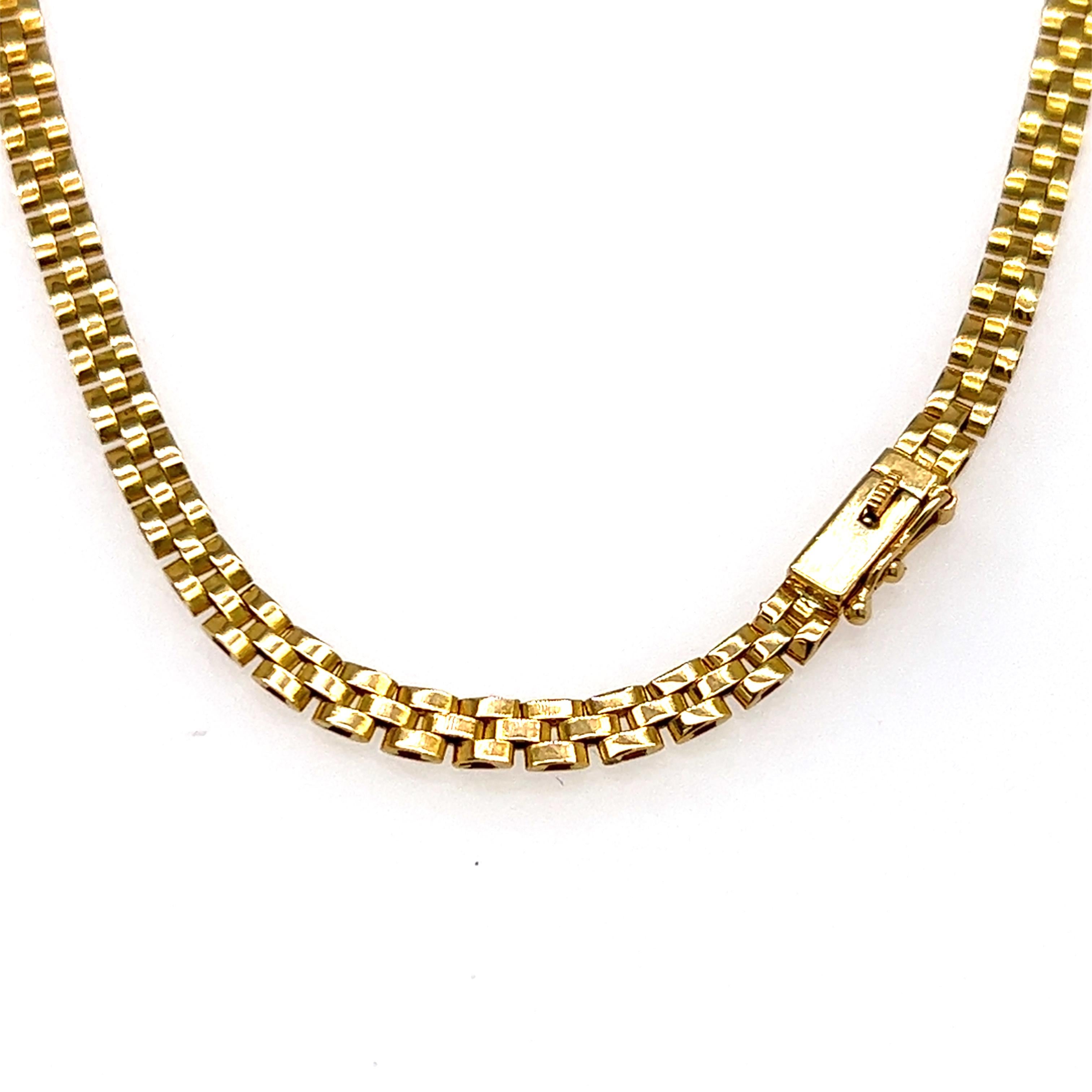 One 18 karat yellow gold 22-inch brick link pendant necklace featuring sixty-two (62) baguette diamonds in a freeform pattern, approximately 1.50-carat total weight with matching G/H color and VS/SI clarity.  The necklace is complete with a box
