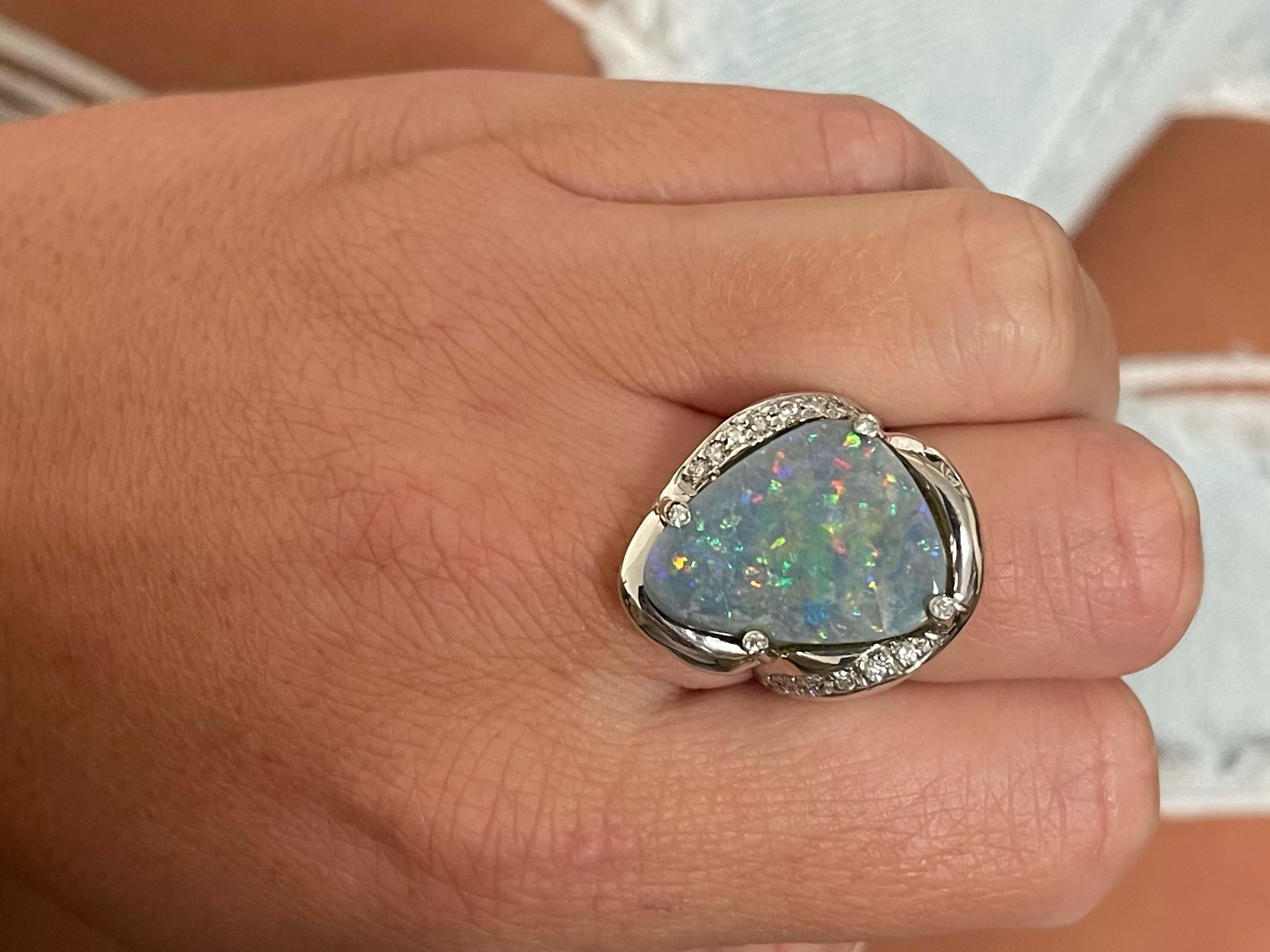 Item Specifications:

Metal: 18K White Gold 

Style: Opal and Diamond Ring

Total Weight: 16.10 Grams

Gemstone Specifications:

Center Gemstone: Black Opal

Gemstone Measurements: 19.81 mm x 15.14 mm x 5.31 mm

Gemstone Carat Weight: ~5