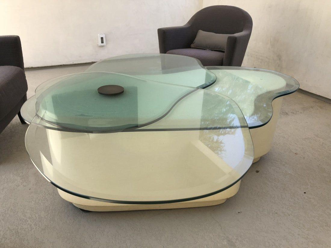 Freeform coffee table in cream lacquer finish with 3 swiveling glass tops that can expand in size as you open.

The piece is very rare and unique, the design execution is flawless and a great addition to Mid-Century Modern and contemporary
