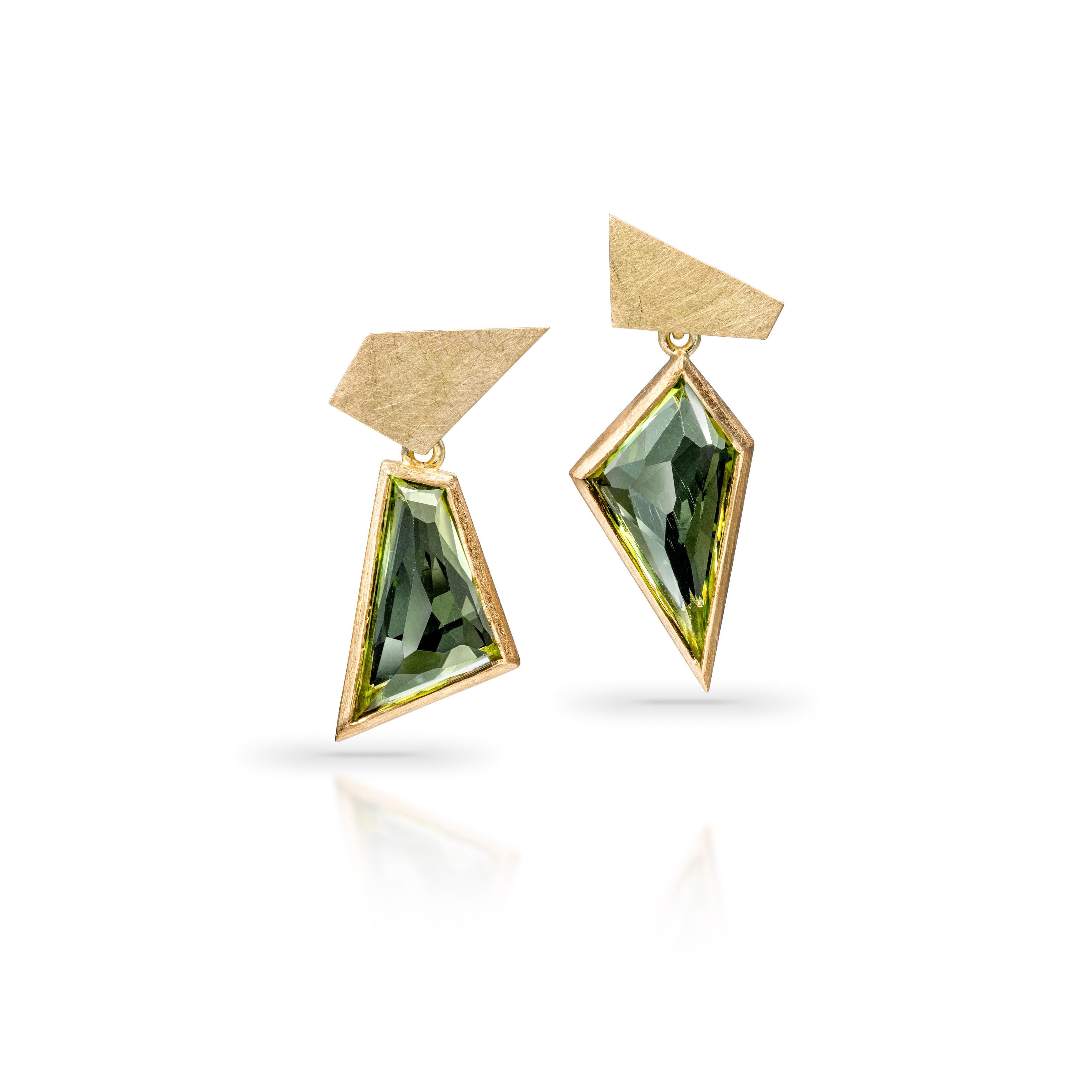 Gorgeous bright green tourmalines, hand cut by Mark in his studio in London, weighing a total of 5.15cts. The one-of-a-kind tourmaline gemstones are set in 18ct yellow gold setting. Coming together in a geometric and asymmetric signature