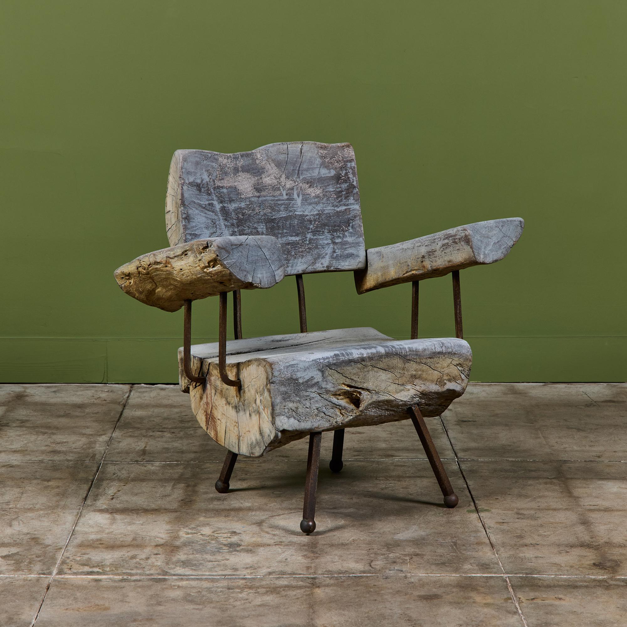 Freeform wood lounge chair by Sabena of Mexico, c.1960s. The lounge chair features a freeform wood slab seat and seat back with two armrests and an iron frame with ball feet.

Dimensions
33.5