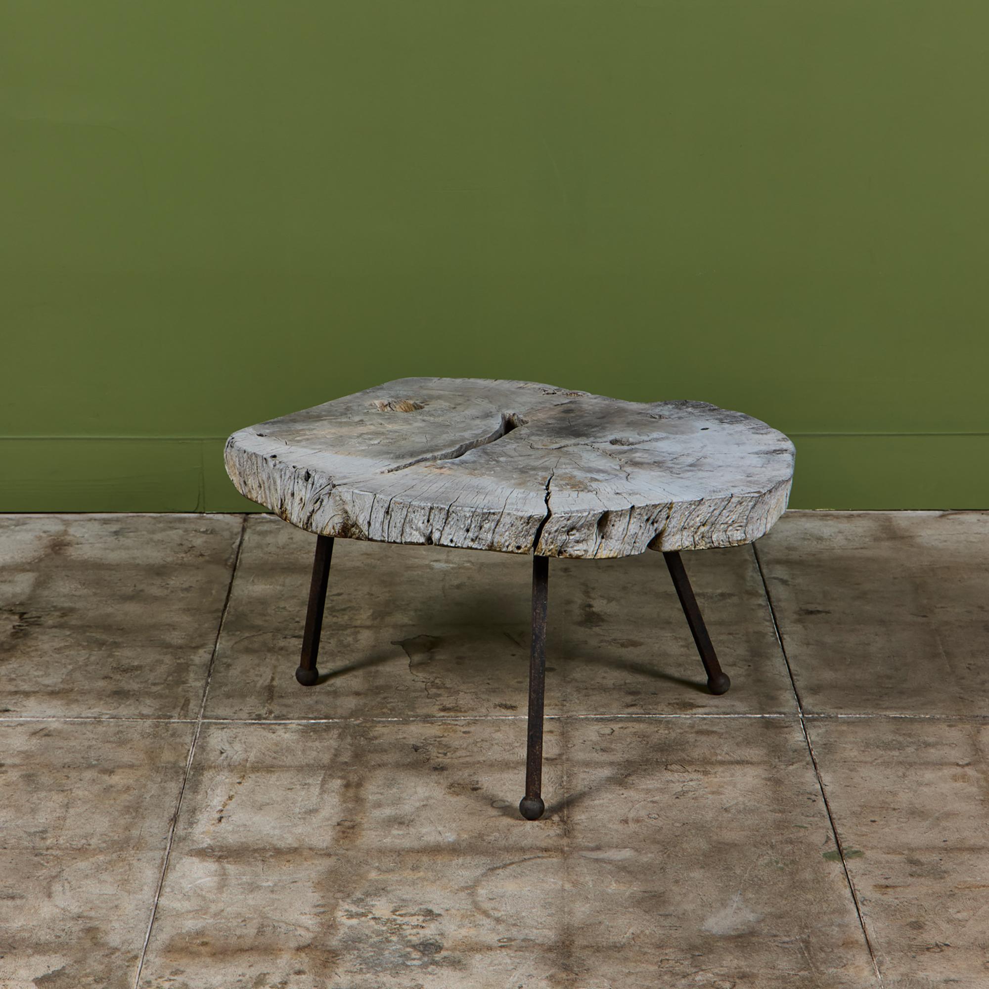 Freeform wood table by Sabena of Mexico, c.1960s. The occasional table features a freeform wood slab table top and an iron frame with ball feet.

Dimensions
32.5