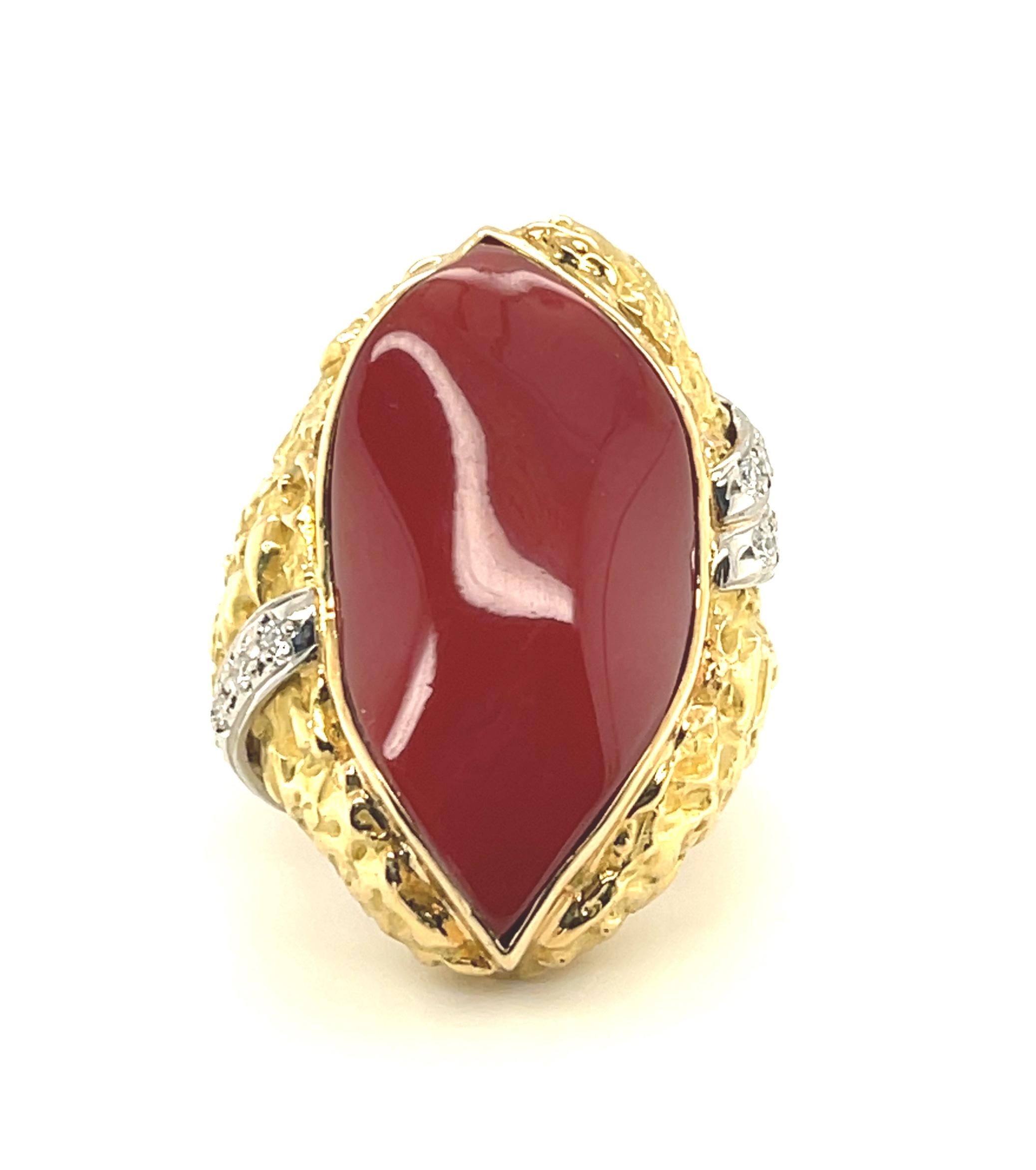 This eye-catching red coral and diamond ring is perfect for someone who is ready to make a statement! The center coral is a freeform leaf shape measuring approximately 1-1/8 in length x 5/8