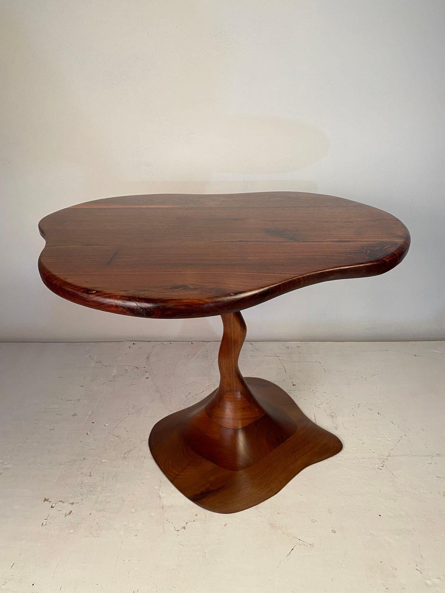 A lovely occasional table in stack laminated solid walnut. Abstract & organic in design. Made by a talented but unknown to us craftsman on the 1970's.
