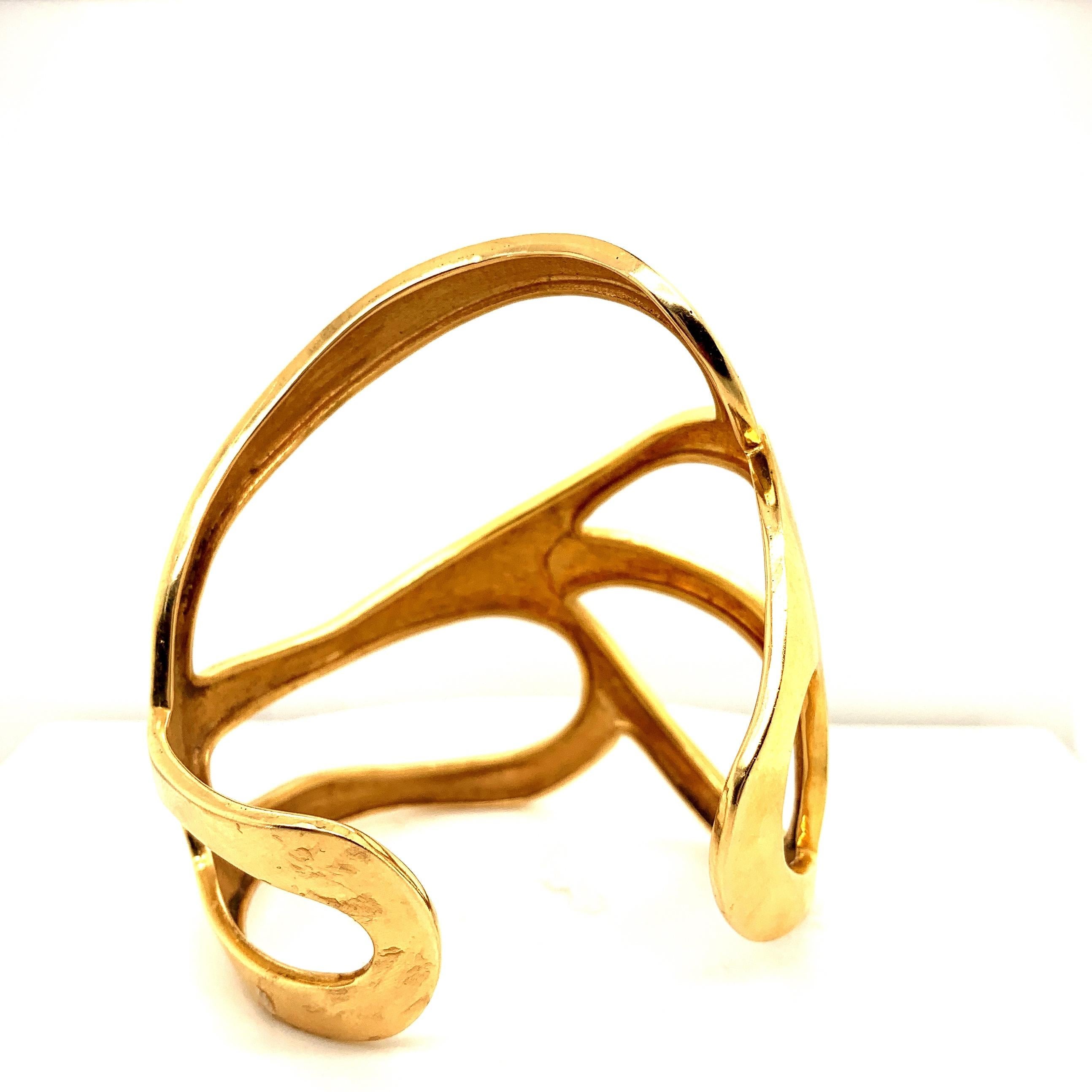 Free form circa 1960’s 18 Gold Cuff.
This large cuff weighting slightly over 90 grams of 18k yellow gold with its free forming design, truly epitomizes the blend of art and jewelry.

Viewings available in our NYC wholesale office by appointment.