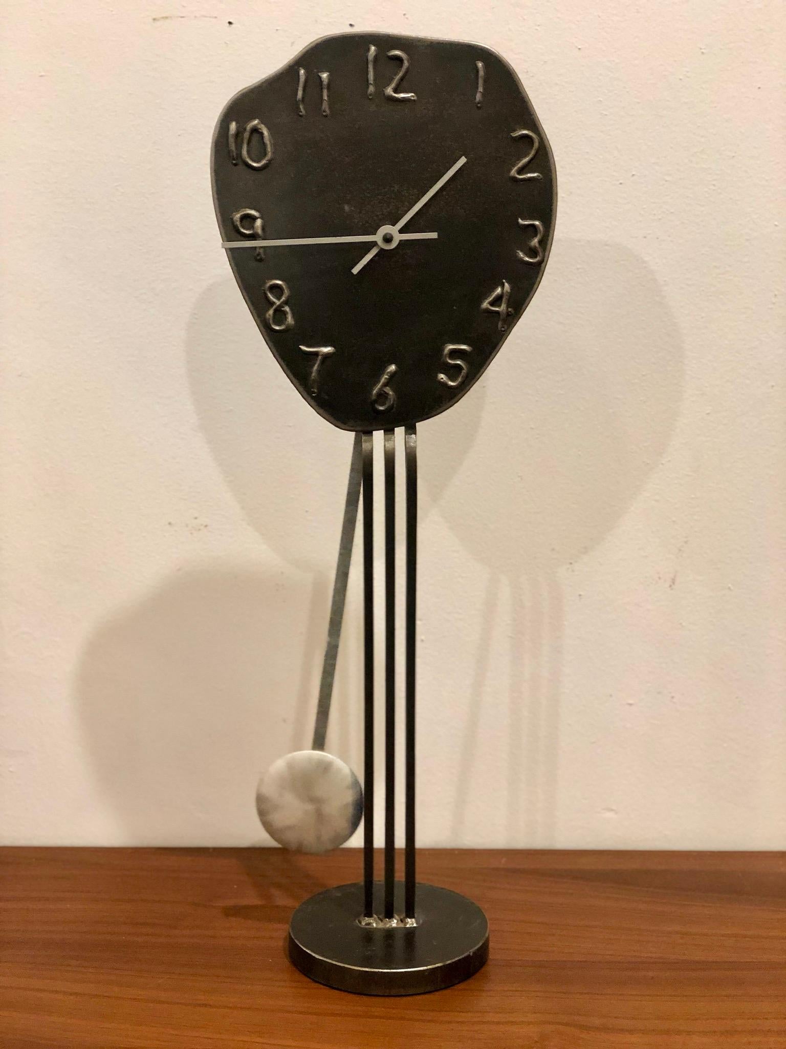 Freeform tall table clock by Artist Jon Surriugarte California design, all handmade in metal and iron signed in the back in the style of Salvador Dali, circa 1991 battery operated in working condition.