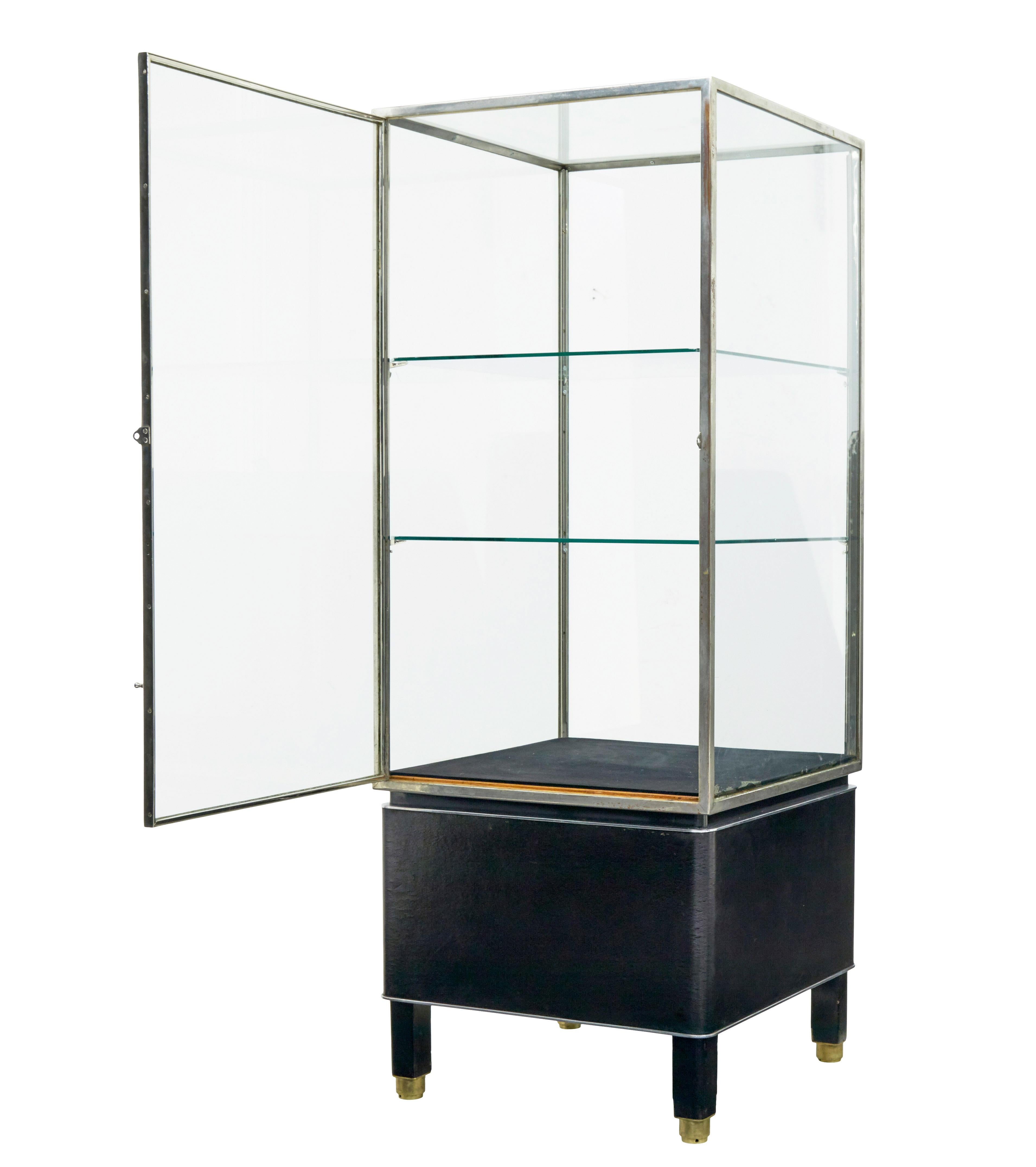 Art deco steel and leather glazed display cabinet circa 1930.

We are pleased to offer this fine quality display cabinet which we found on our travels around europe.

Good quality chromed showcase with original glass, allows 360 viewing for the