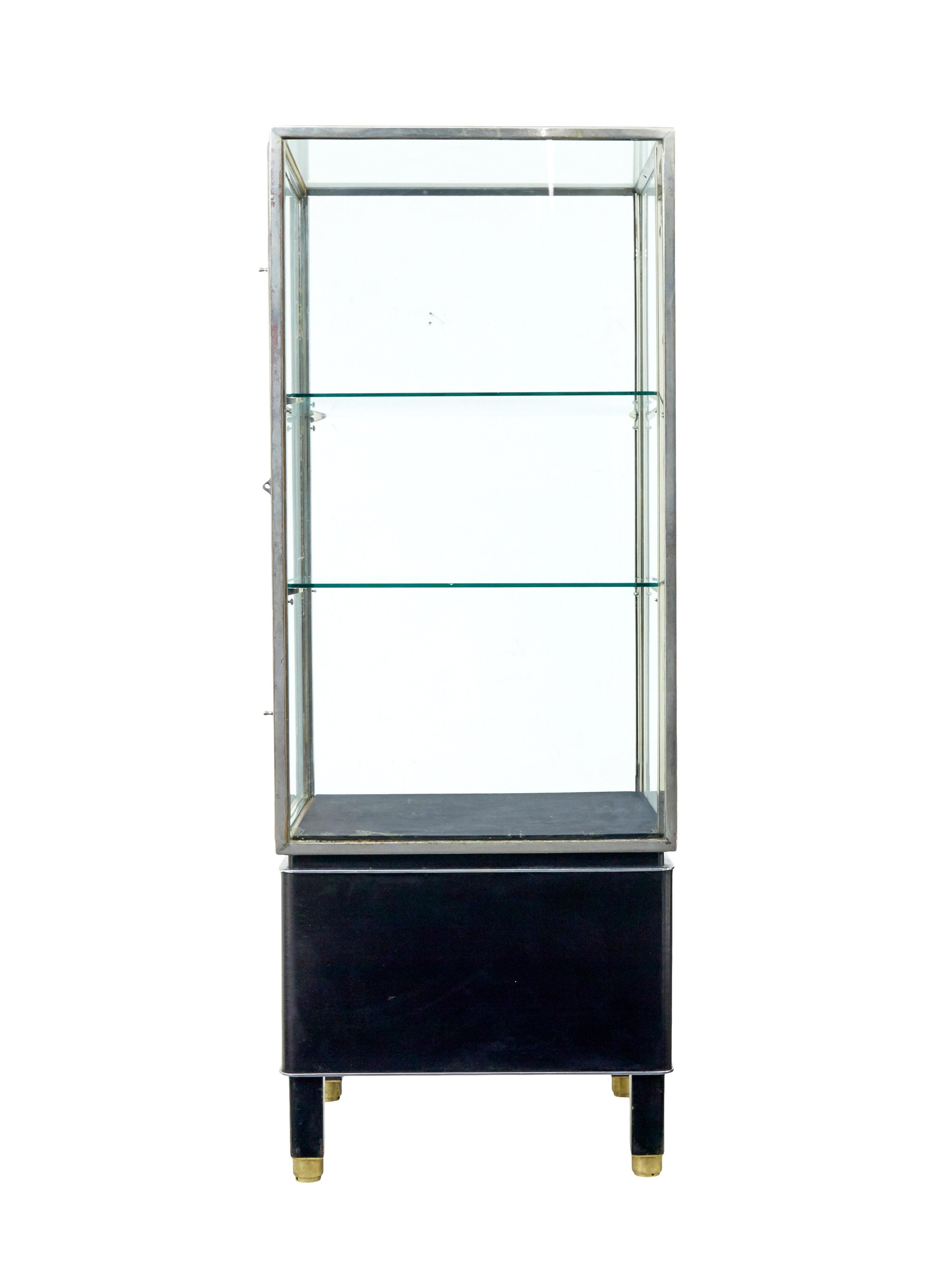 Cast Freestanding Art Deco steel and leather glazed display cabinet For Sale