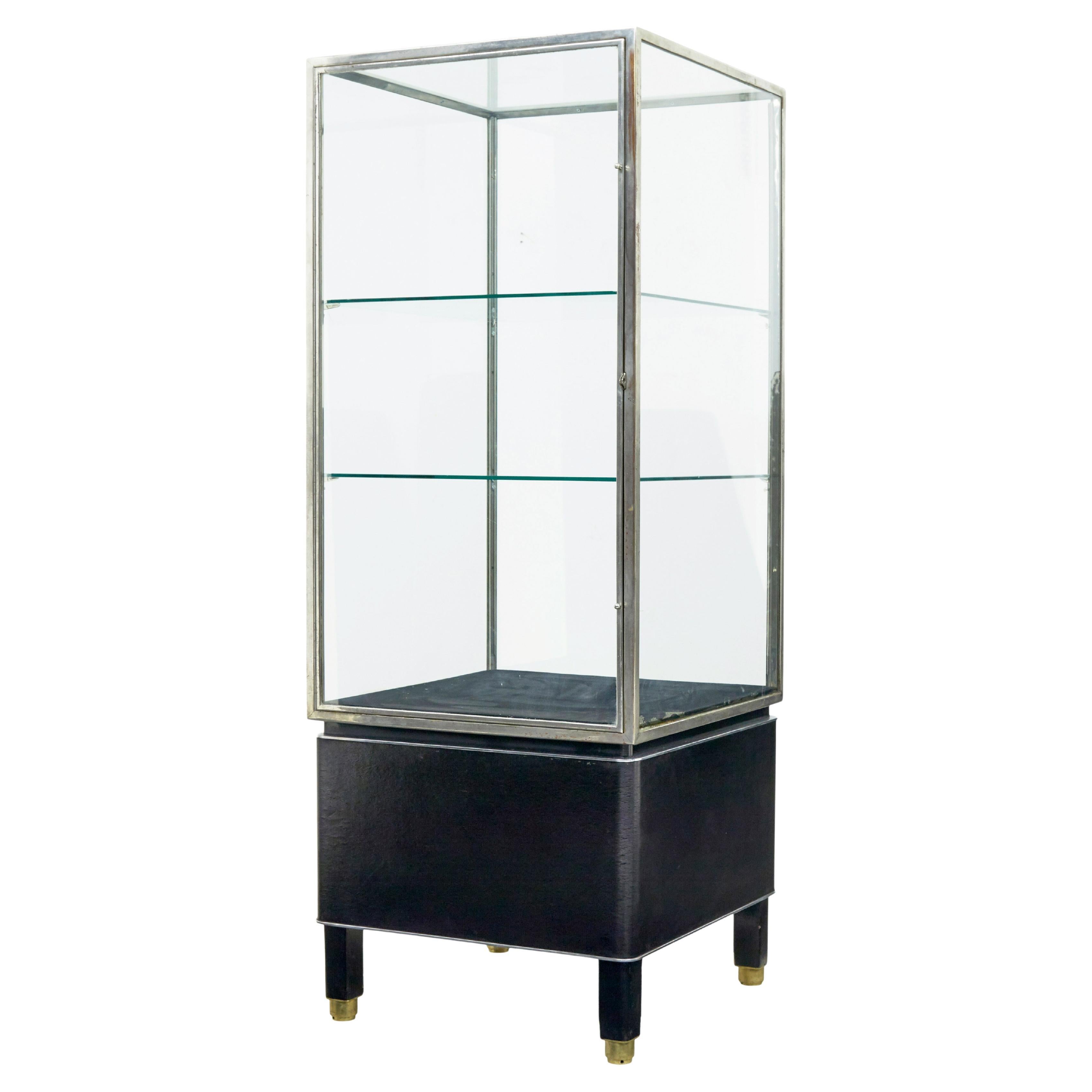 Freestanding Art Deco steel and leather glazed display cabinet For Sale
