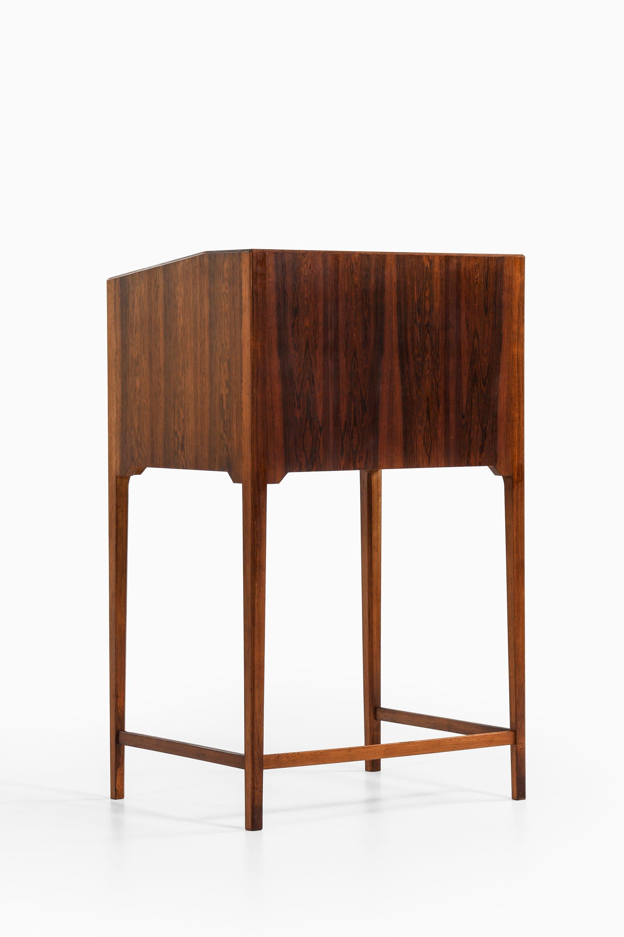 Danish Freestanding Cabinet in Rosewood, Brass and Leather by Frits Henningsen, 1950's For Sale