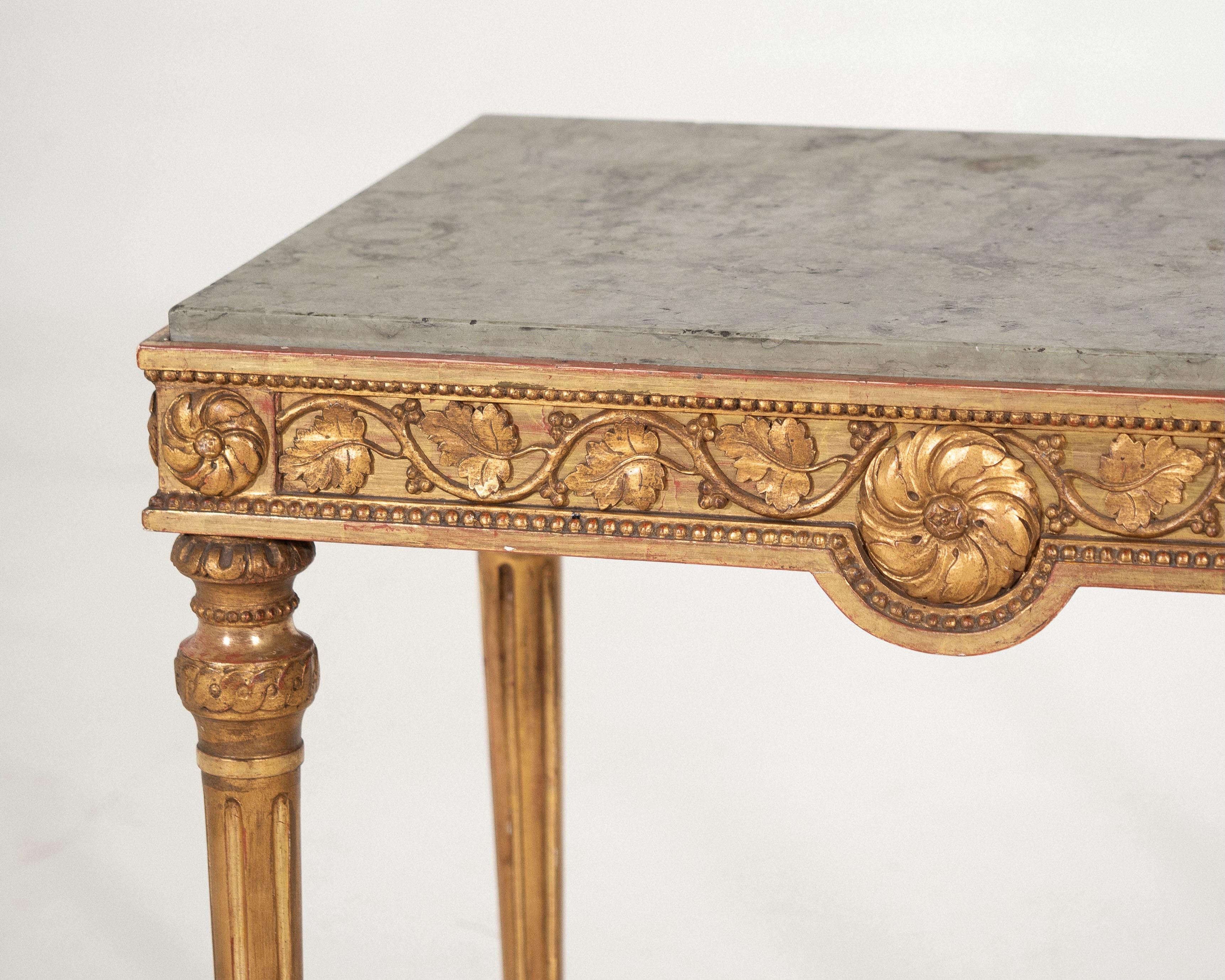 Freestanding Gustavian console table in original guilt with Gotland marble top and beautiful carvings, Stockholm work, 18th C.