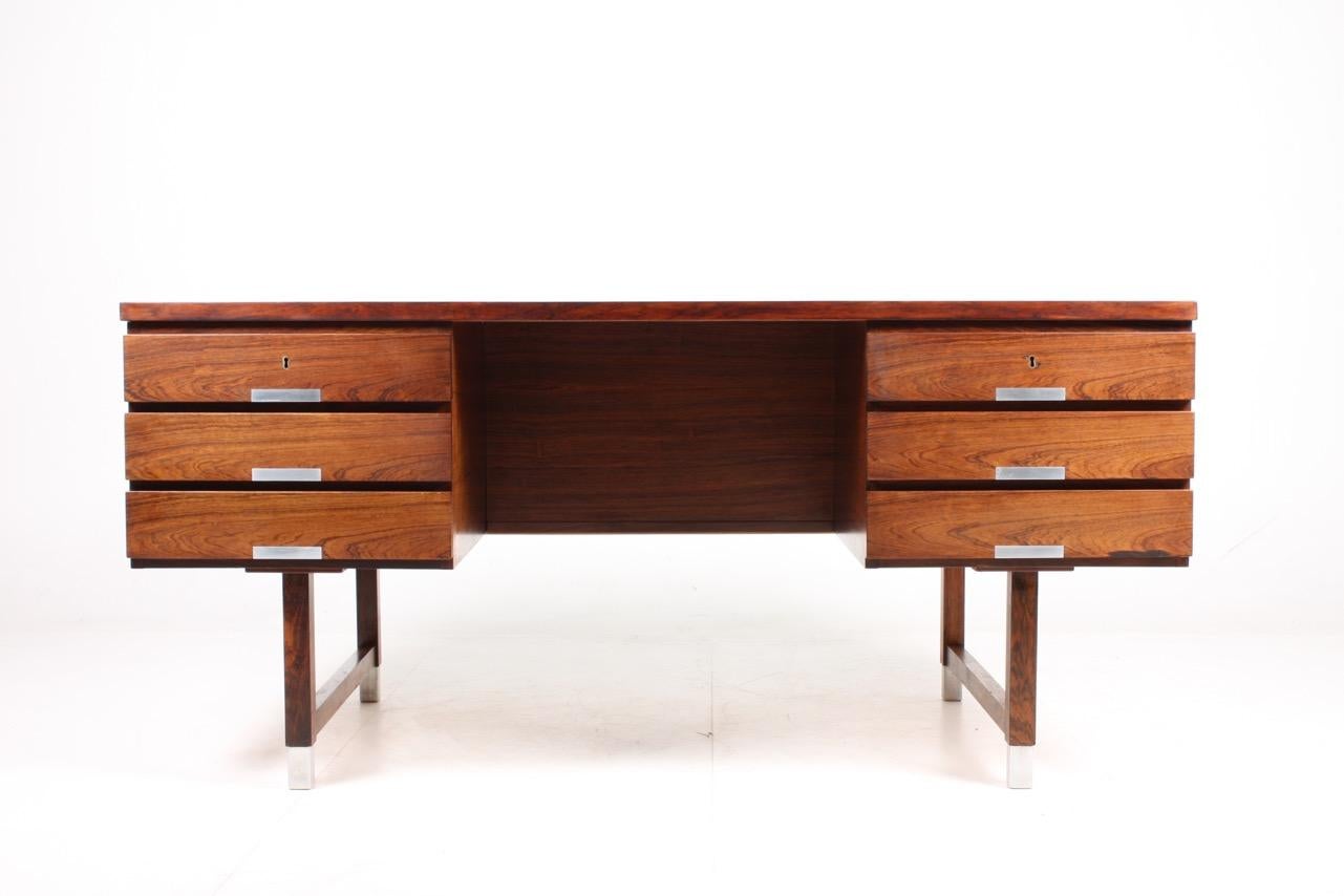 Great looking freestanding desk in rosewood designed, Denmark in 1950s. Very nice original condition.