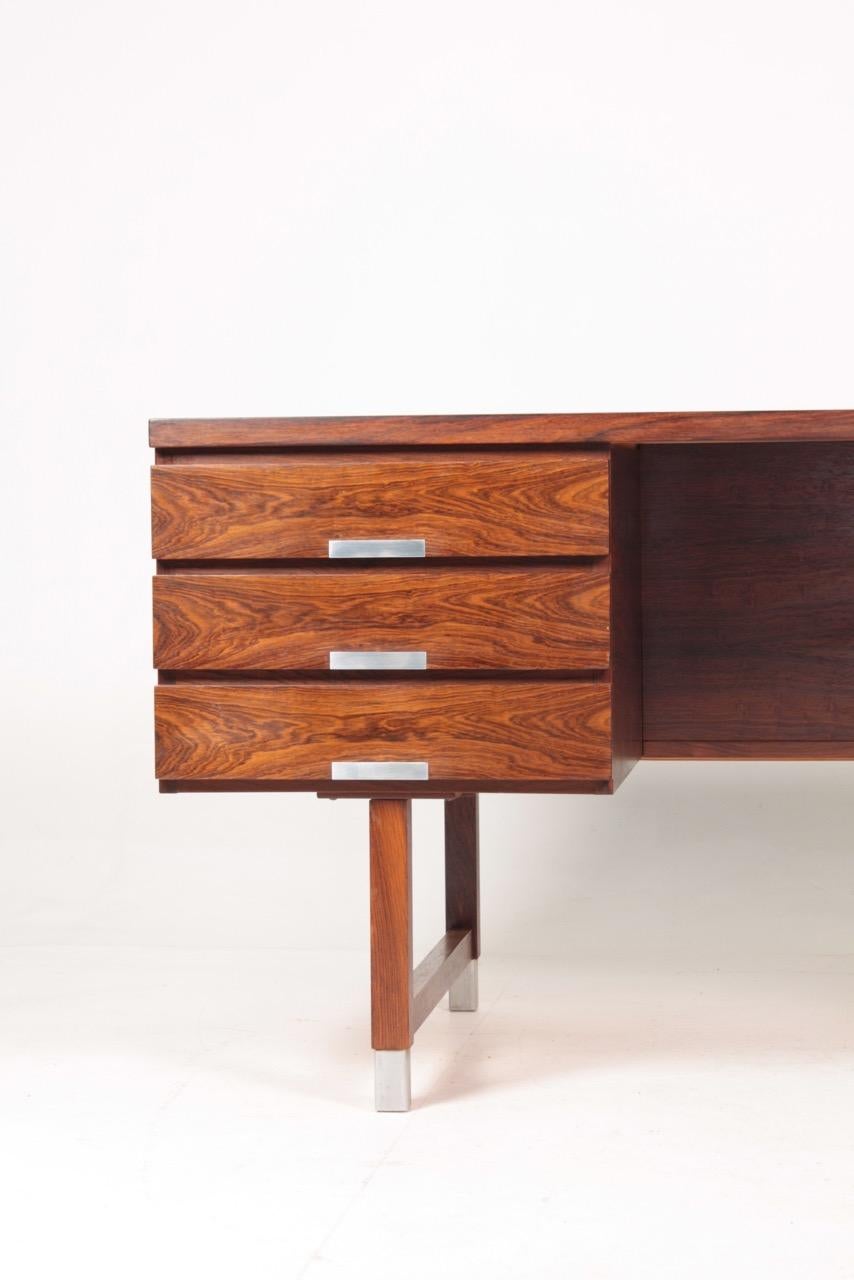 Great looking freestanding desk in rosewood, designed and made by Ejgil Petersen, Denmark in 1950s. Very nice original condition.