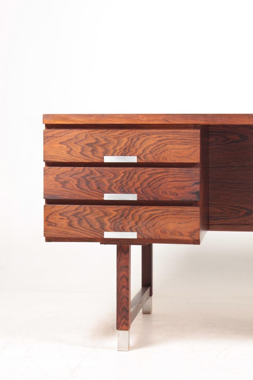 Great looking freestanding desk in rosewood, designed and made by Ejgil Petersen, Denmark in 1950s. Very nice original condition.