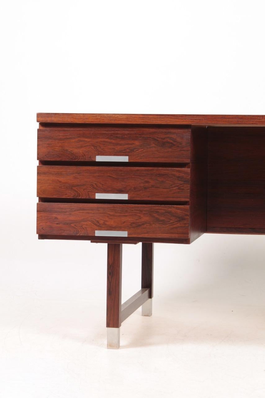 Great looking freestanding desk in rosewood designed, Denmark in 1950s. Very nice original condition.
