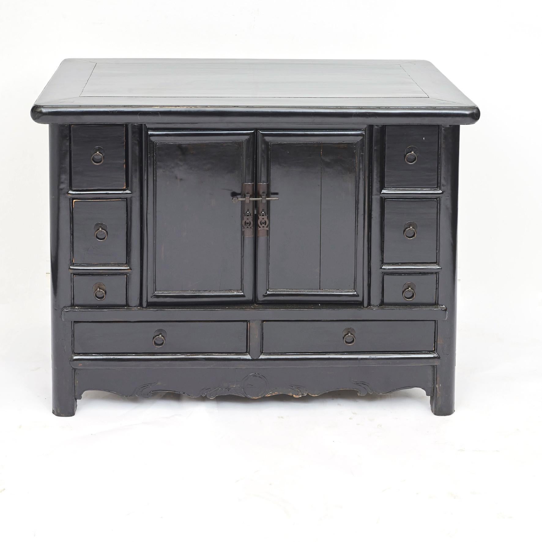 Black lacquer sideboard with multiple drawers and two doors.
From Hebei, circa 1880-1900.
This sidebord is perfectly useable as a freestanding centerpiece given the depth: 68 cm / 26.8 in.