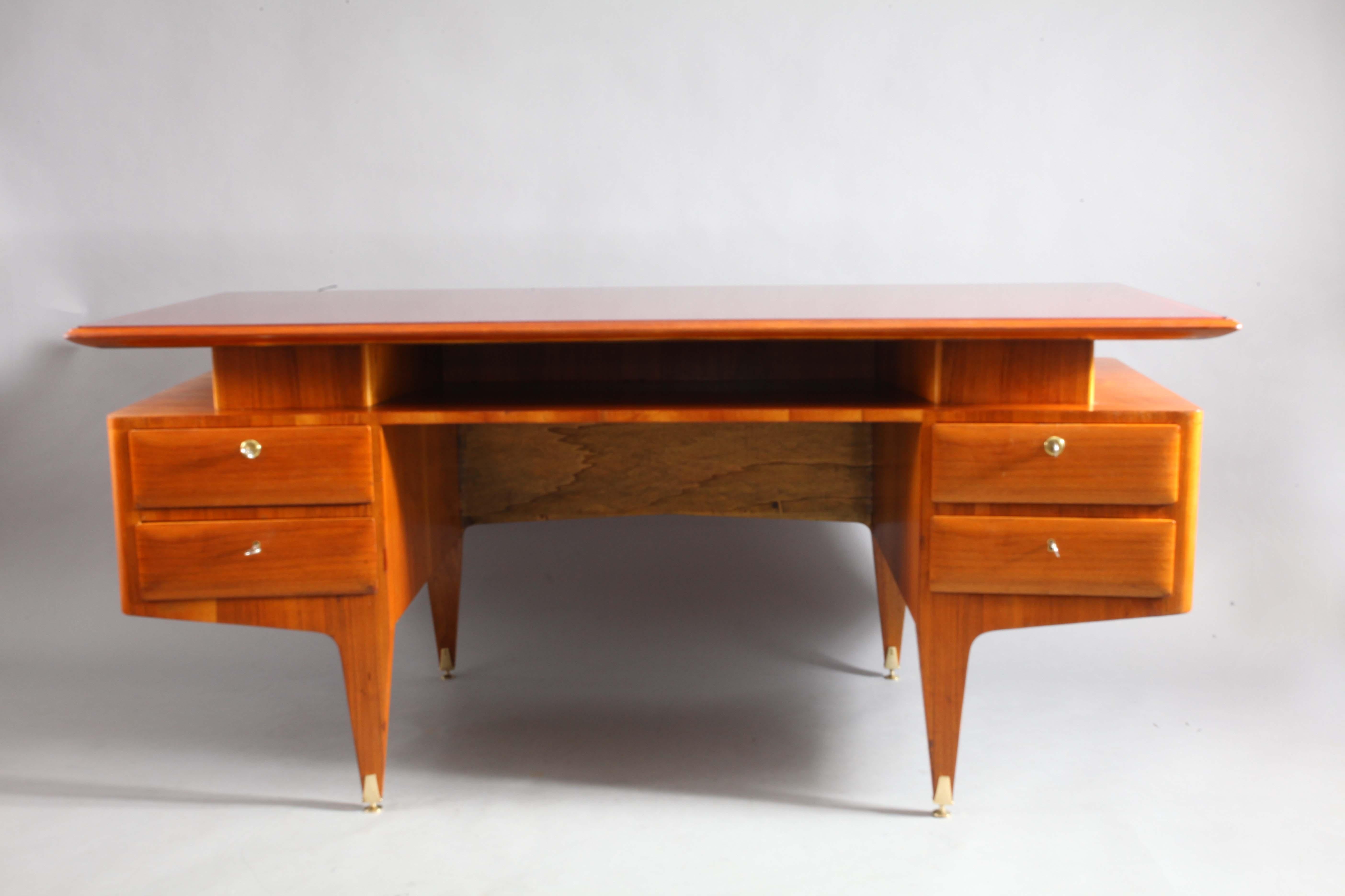 Executive rosewood writing desk,
Vittorio Dassi,
Italy, 1950.
Four drawers,
brass legs height adjustable,
red glass top
Measures: Width 183 cm, depth 90 cm, height 79 cm.