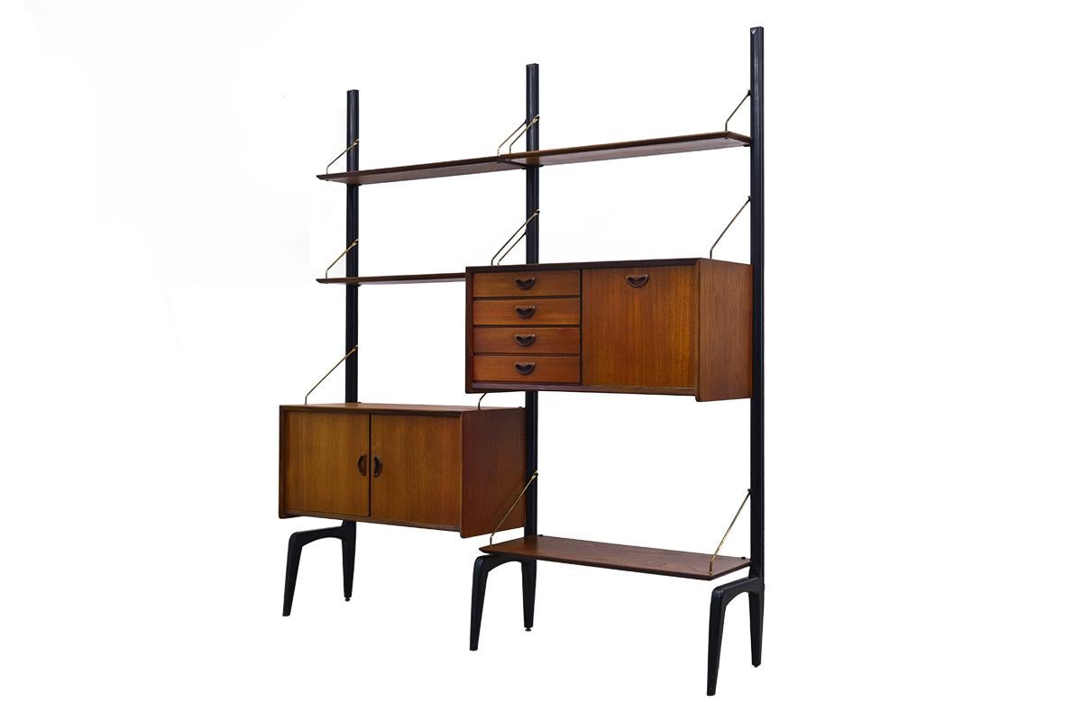 Charismatic freestanding modular wall system made in teak veneer, designed by the Dutch Modernist Louis Van Teeffelen for Webe Holland in the 1950s.
The cabinet has lots of storage space and shelves.