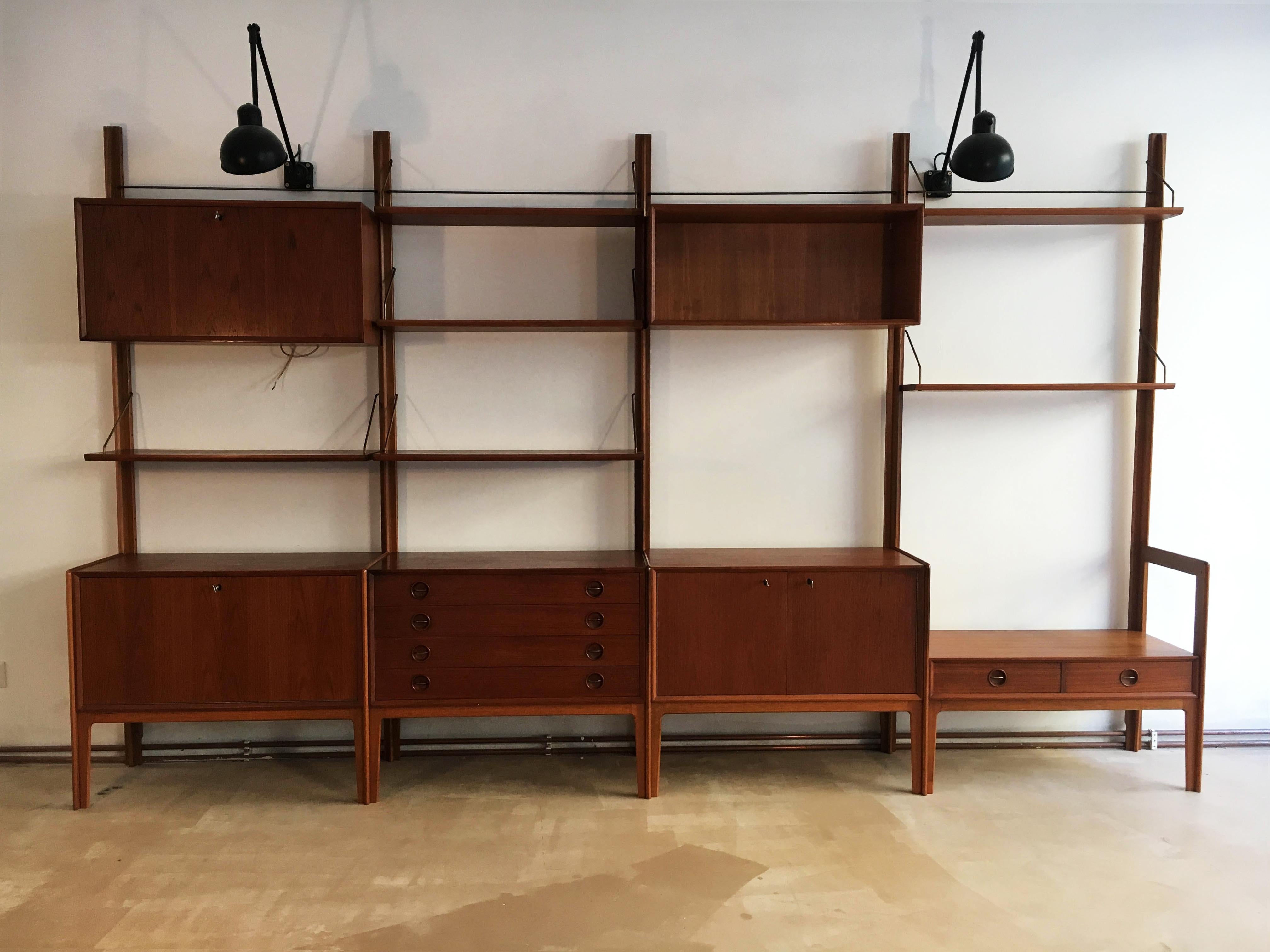 Original freestanding teak wall unit by Fredrik A. Kayser for Gustav Bahus, Norway, 1960s. The system is designed to be completely freestanding, no mounting to a wall is required. Can be used as a room divider as well.