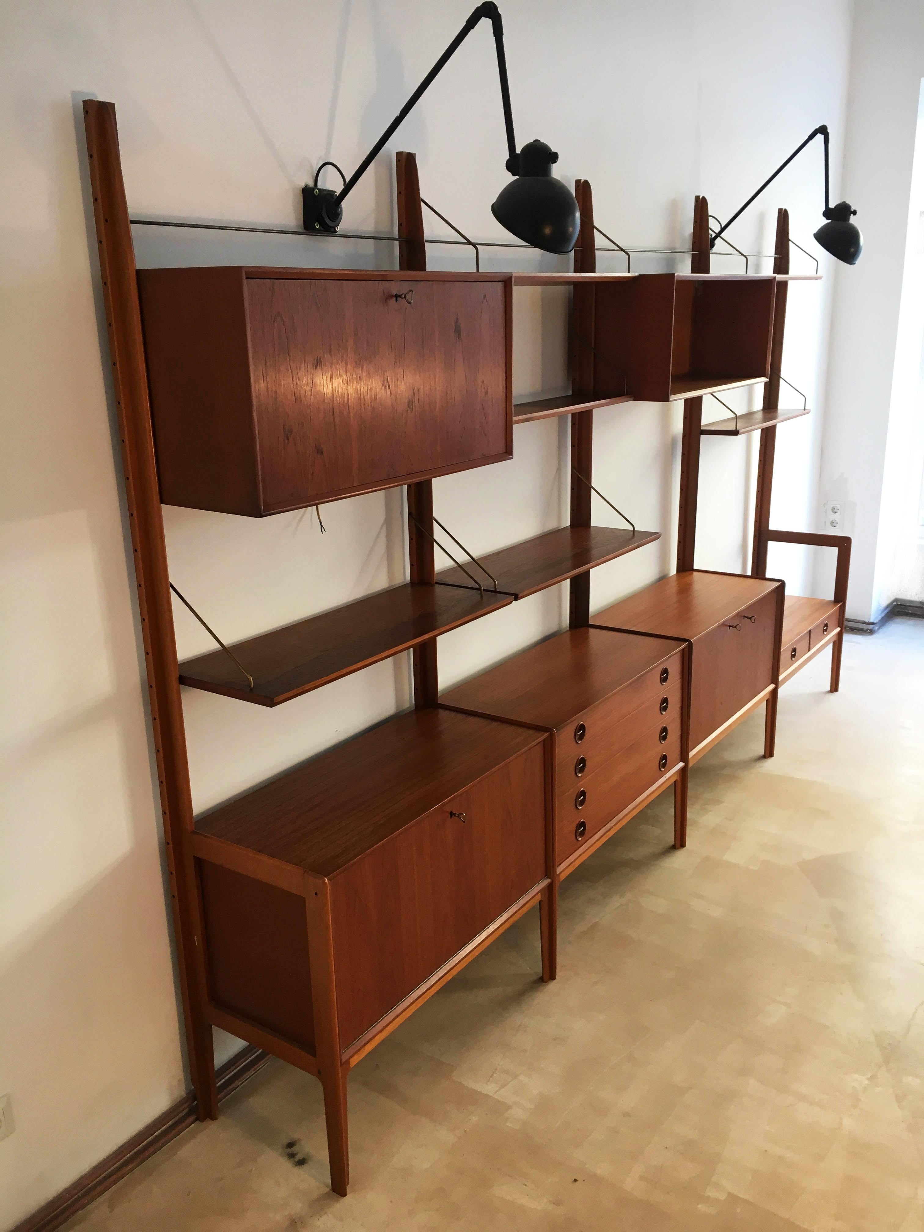 Freestanding teak wall unit by Fredrik A. Kayser for Gustav Bahus, Norway, 1960s. This freestanding Norwegian Wall Unit is made of Teak, from the 1950s by Gustav Bahus, and is loaded with cabinetry, shelves, and teak back panels. It is fully