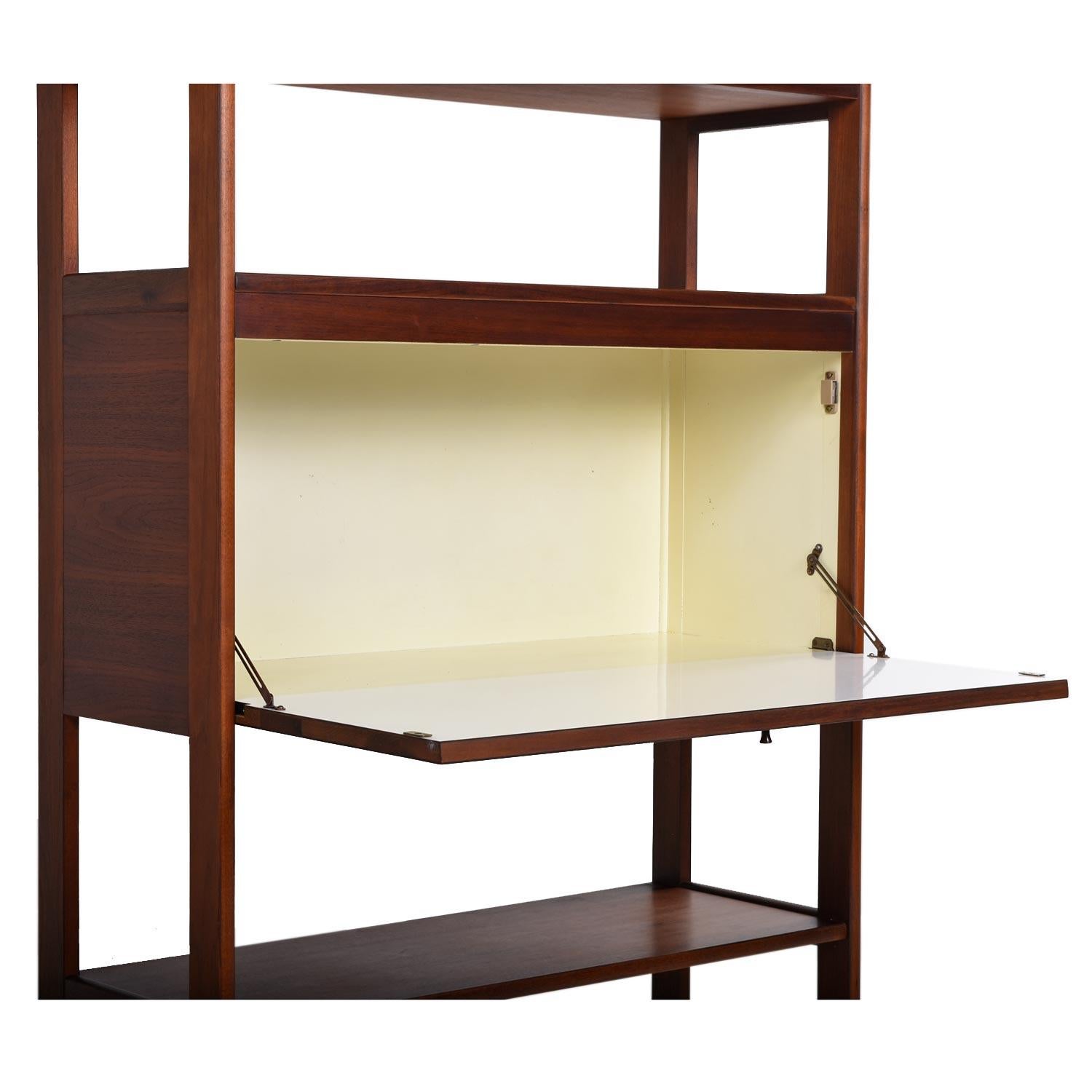 Gorgeous Scandinavian modern open two-piece walnut wall unit room divider. Stands on its own and is finished on both sides, so it can act as a room divider. Configure the cabinets however you wish to create a matrix that suits your needs. The larger