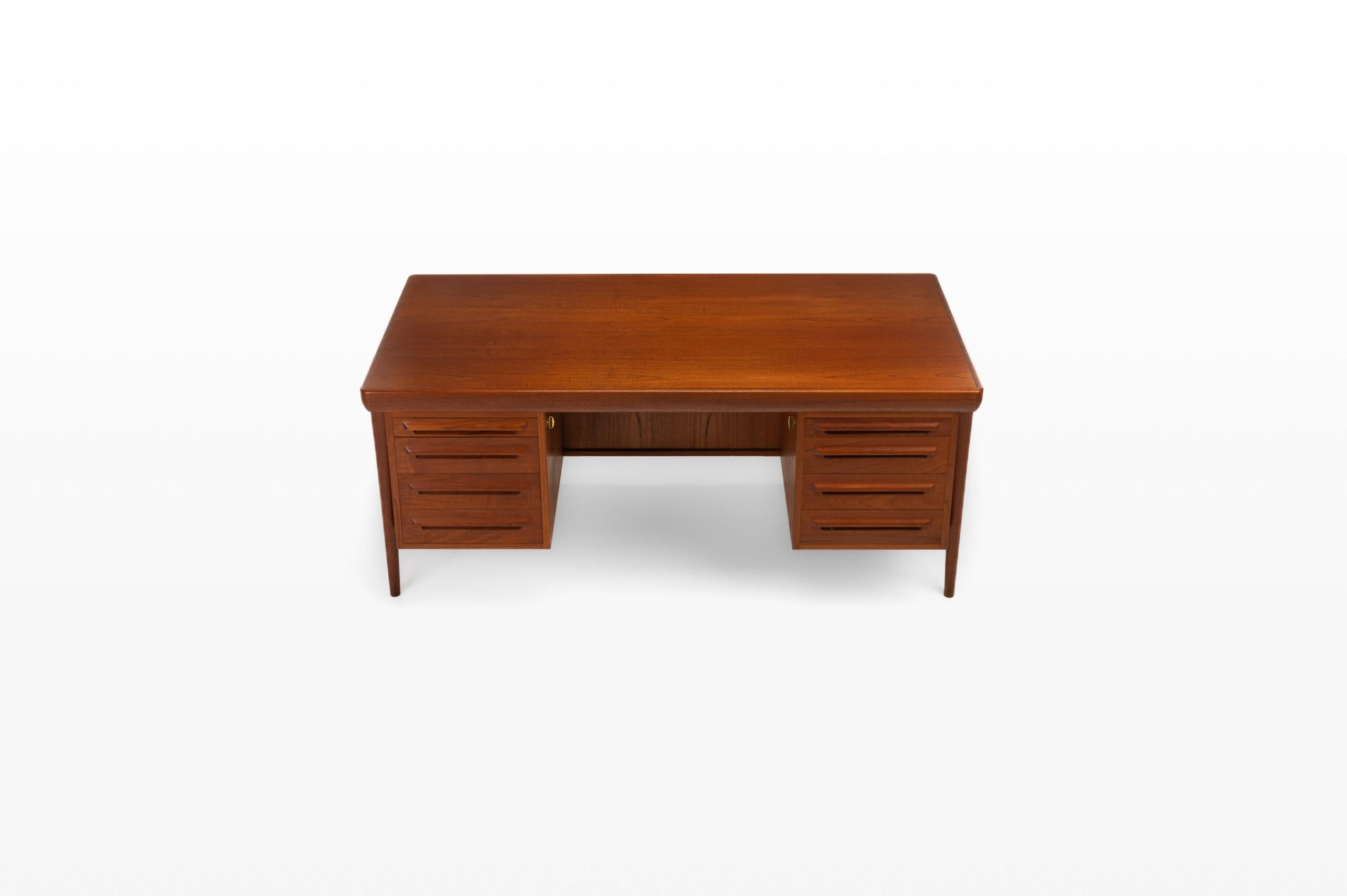 Mid century freestanding writing desk in teak designed by Ib Kofod Larsen for Faarup Møbelfabrik. There are eight drawers and is in great condition. A real eye catcher for your interior.
 