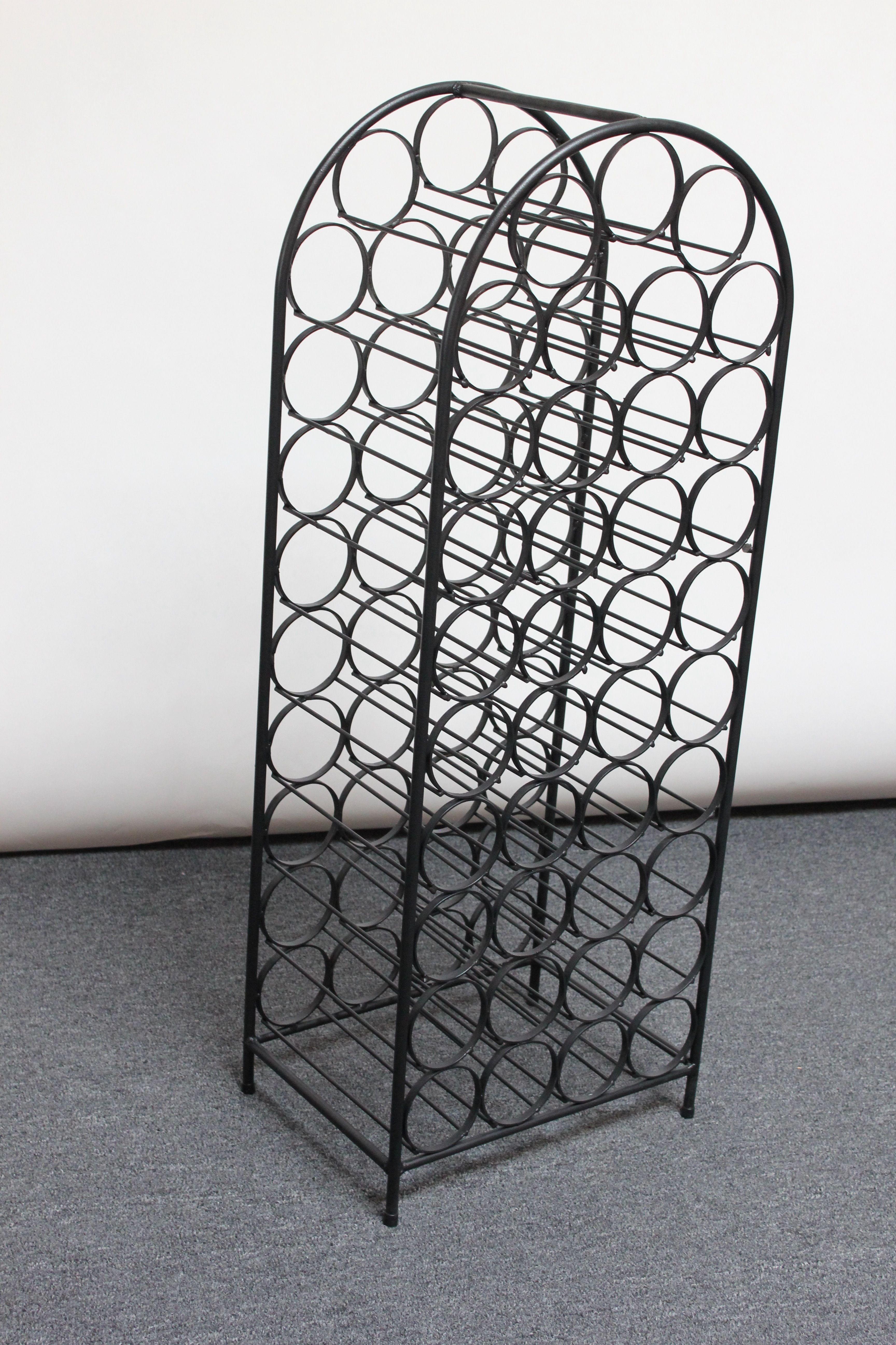 Arched wrought iron wine rack accommodating 39 wine bottles designed by Arthur Umanoff for Shaver Howard and distributed by Raymor.  Graceful form and intriguing visual effect from angles that meld the rods and circles together. Near mint, restored
