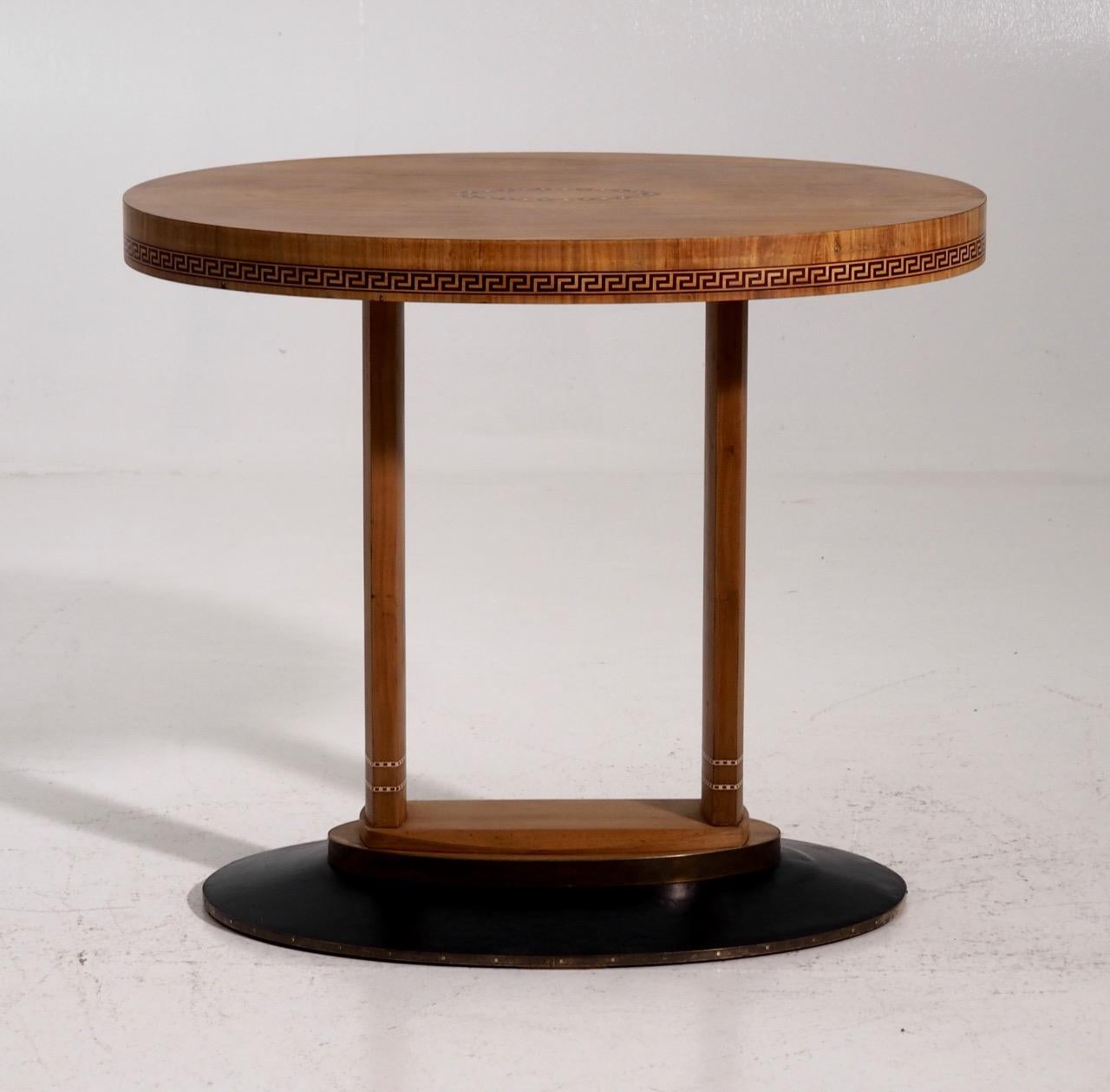 A very rare freestanding Art Nouveau oval table, with two pillars made in cherrywood. Inlaid with mother of pearl and with various fruitwood. Probably by one of the famous Austrian architects, circa 1905.
