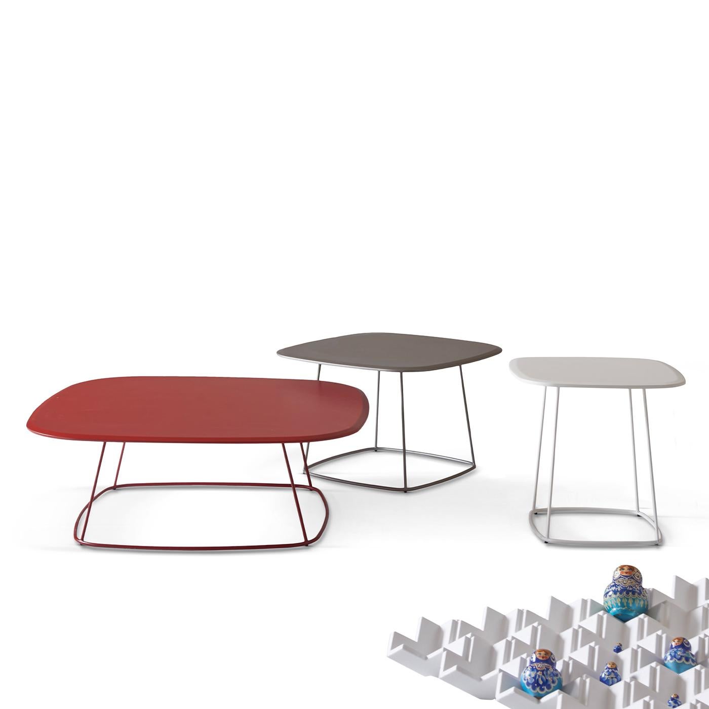 The Freestyle Coffee Table by Angeletti Ruzza is a spectacular piece of minimalist design, defined by clean and essential lines. Its smooth and sleek profile is enhanced with a matte red lacquer coloring the MDF top, which sturdily rests on a thin