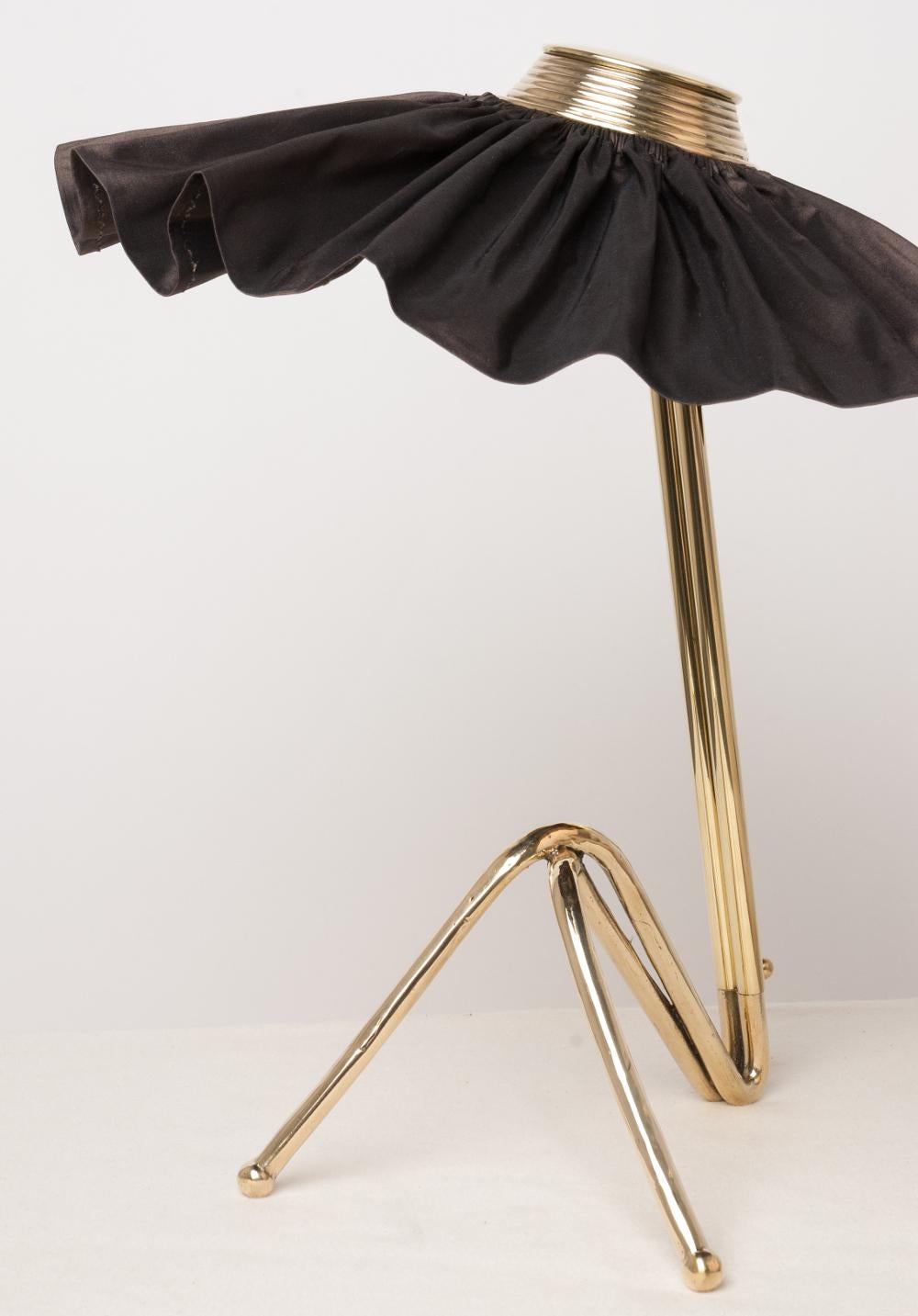 This table lamp is a contemporary piece, made entirely by hand in Tuscany Italy, 100% of Italian origin. 
Ultra-femme desk lighting, lady-like forms creates an elegant silhouette with soft curves; like the overlap of legs and the silk skirt seems to