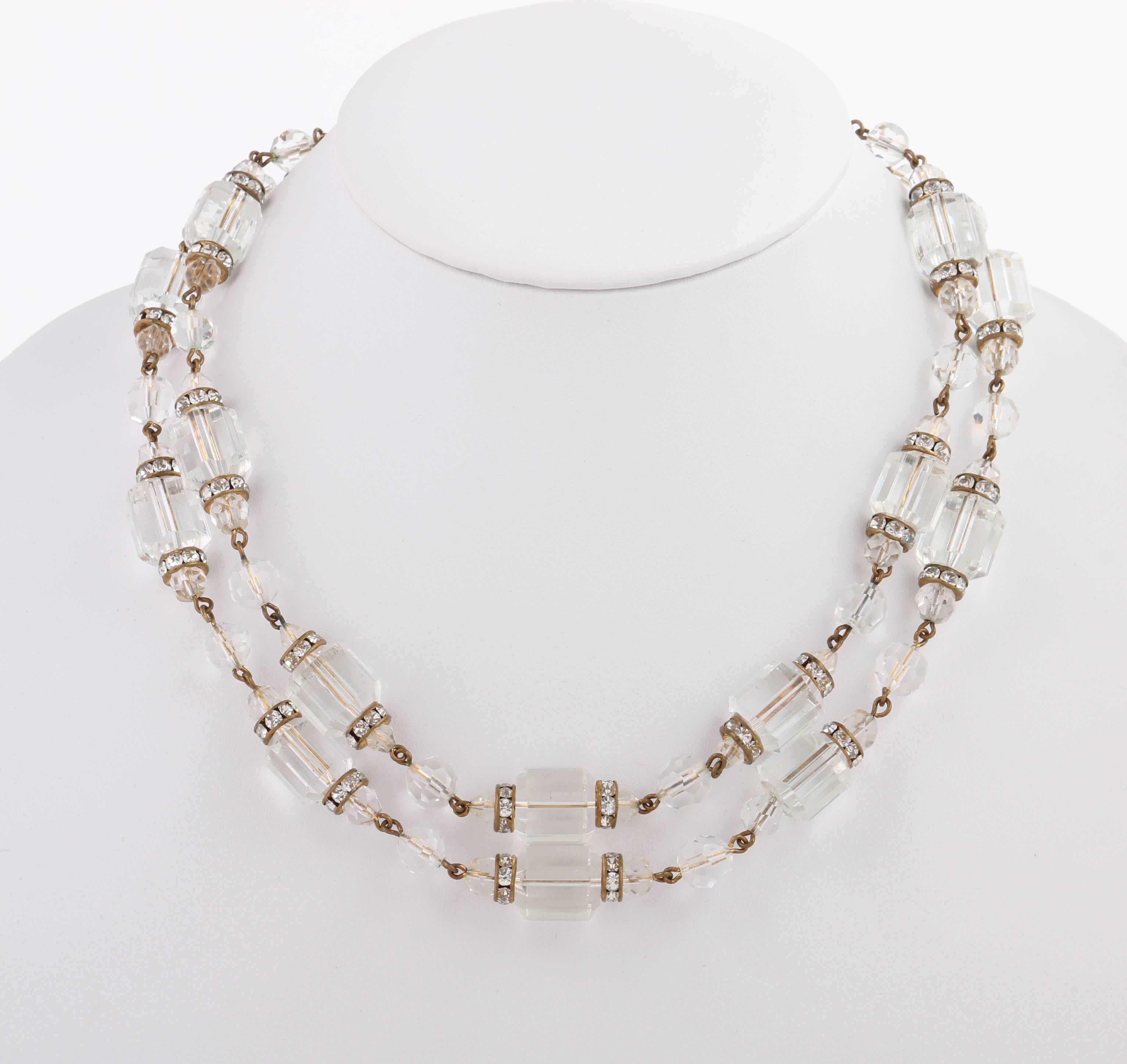 Vintage Freirich c.1960's clear barrel cut crystal beaded double strand choker necklace. Designed by Solomon Freirich. Two beaded strands made up of crystal clear faceted glass barrel beads (14 mm) set between rhinestone set spacer discs (3 mm) and