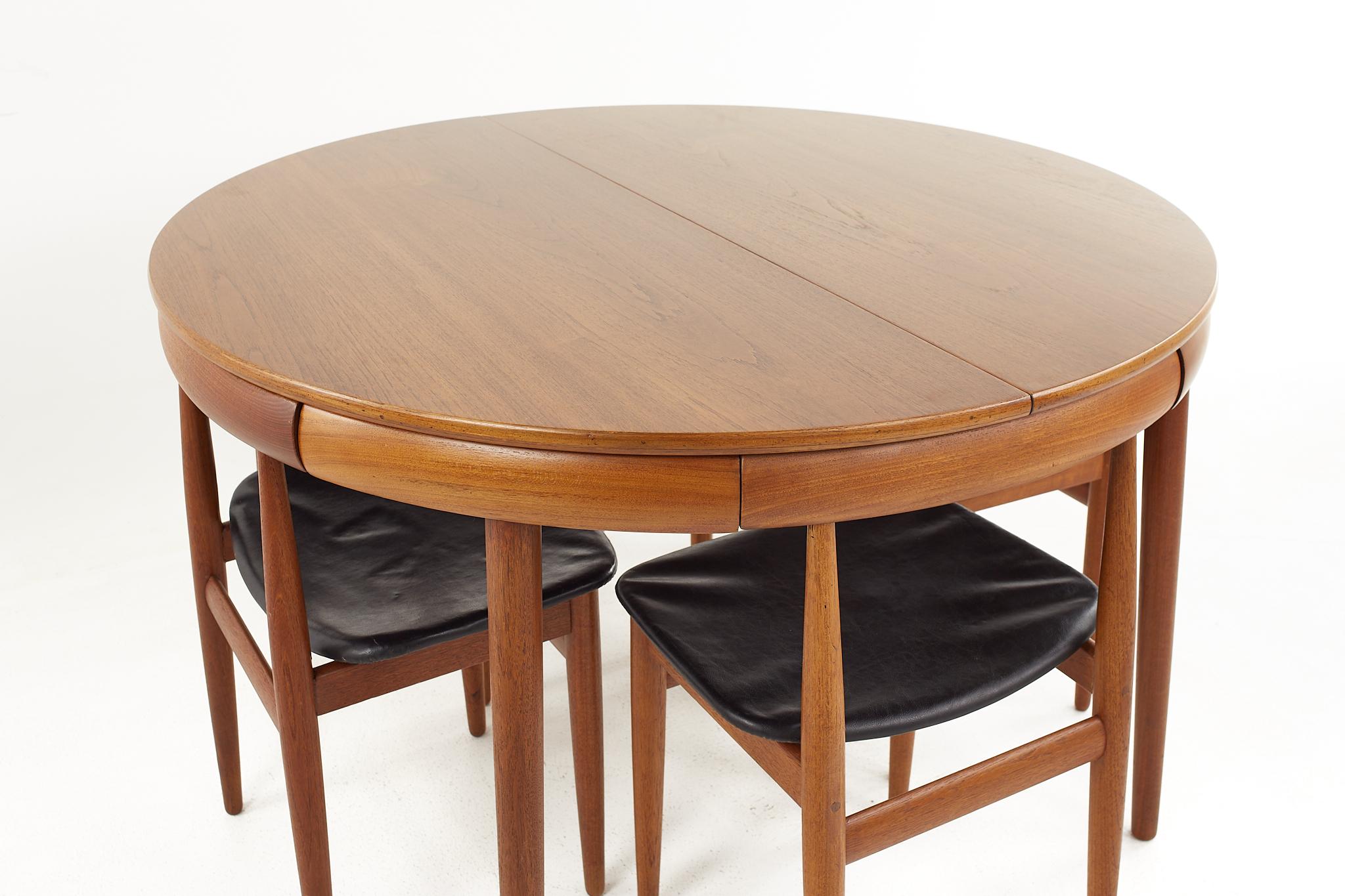 Danish Frem Rojle Mid-Century Teak Hidden Leaf Dining Table with 6 Nesting Chairs