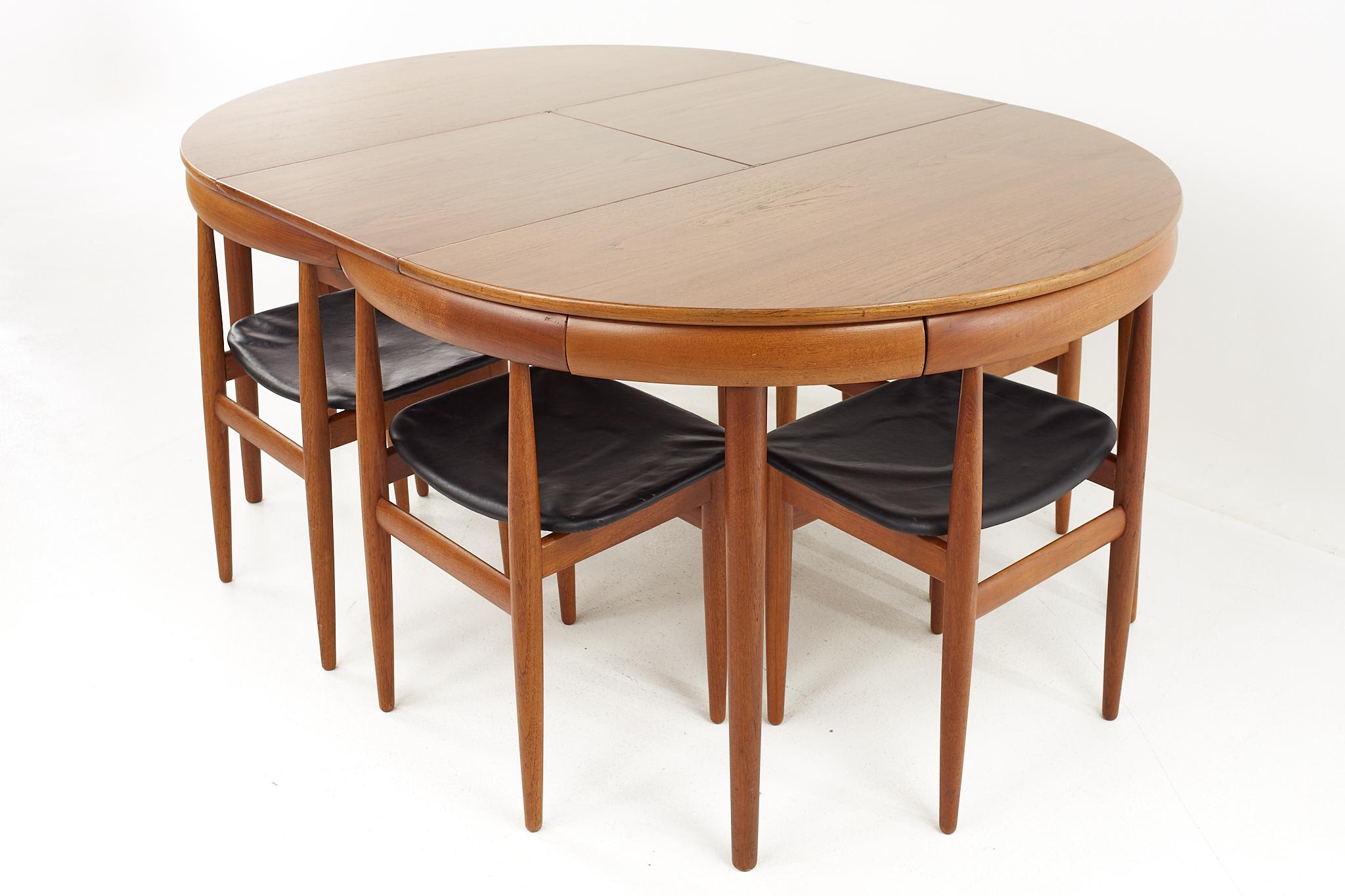 Late 20th Century Frem Rojle Mid-Century Teak Hidden Leaf Dining Table with 6 Nesting Chairs