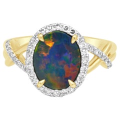 Fremonti 14-karätiger Gelbgold-Ring mit ovalem Boulderopal und runden Diamanten im Halo-Design sowie Crossover-Element