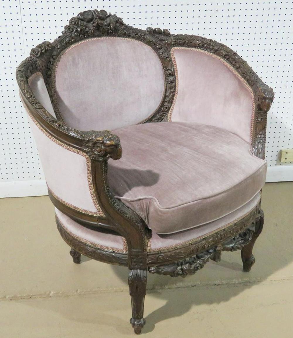 This is a gorgeous 1920s era bergère or canape. The chair has incredible carving and detail. The chair measures 36