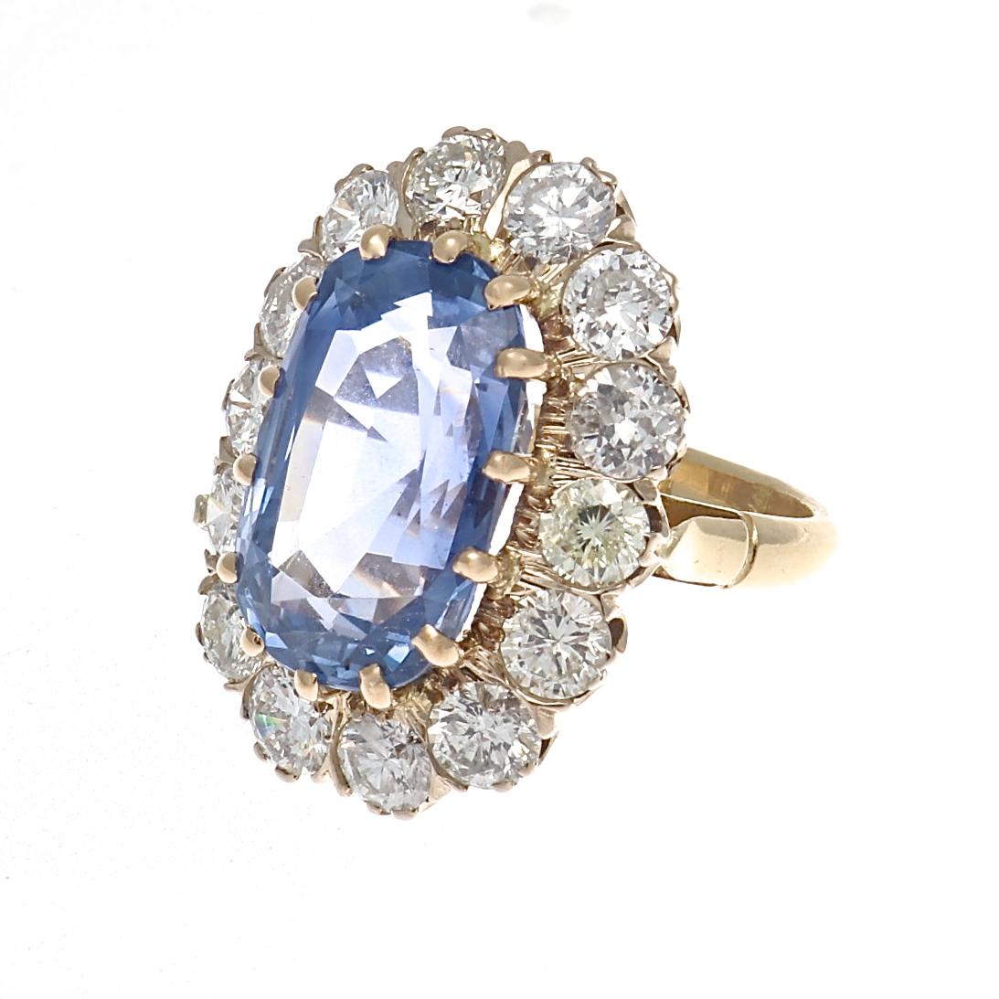 Dream ring found!  Featuring a heavenly cornflower blue faceted oval 10.23 carat GIA certified, natural Ceylon sapphire that has no indications of heat treatment. The surrounding halo of lively white round diamonds weigh approximately 2.80 carats.